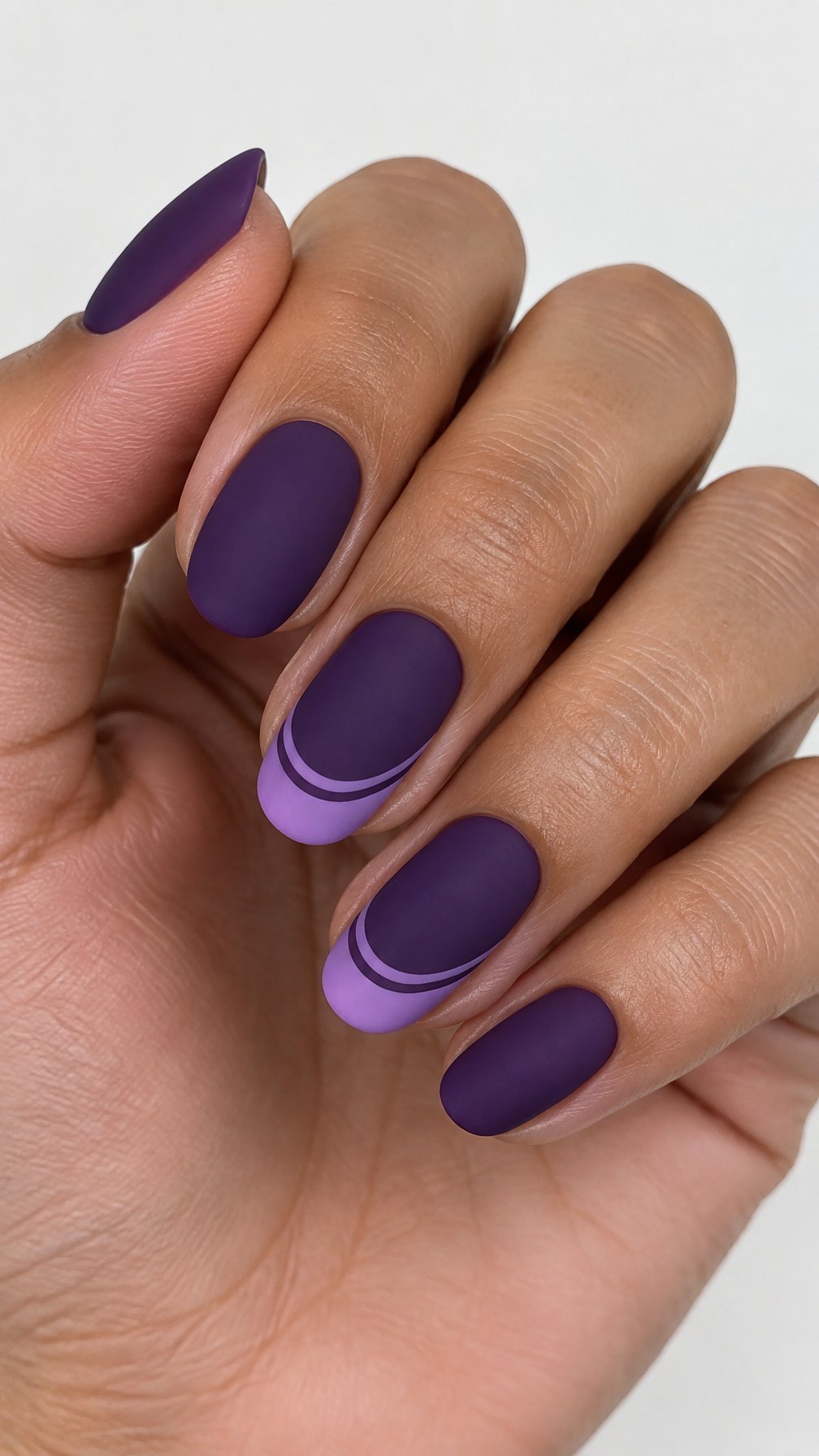 Purple French-tip nails featuring double lavender lines