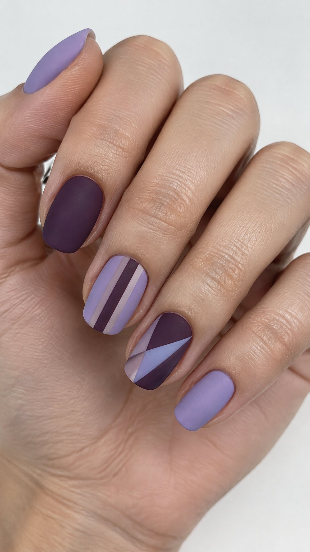 Lilac and plum geometric striped nails