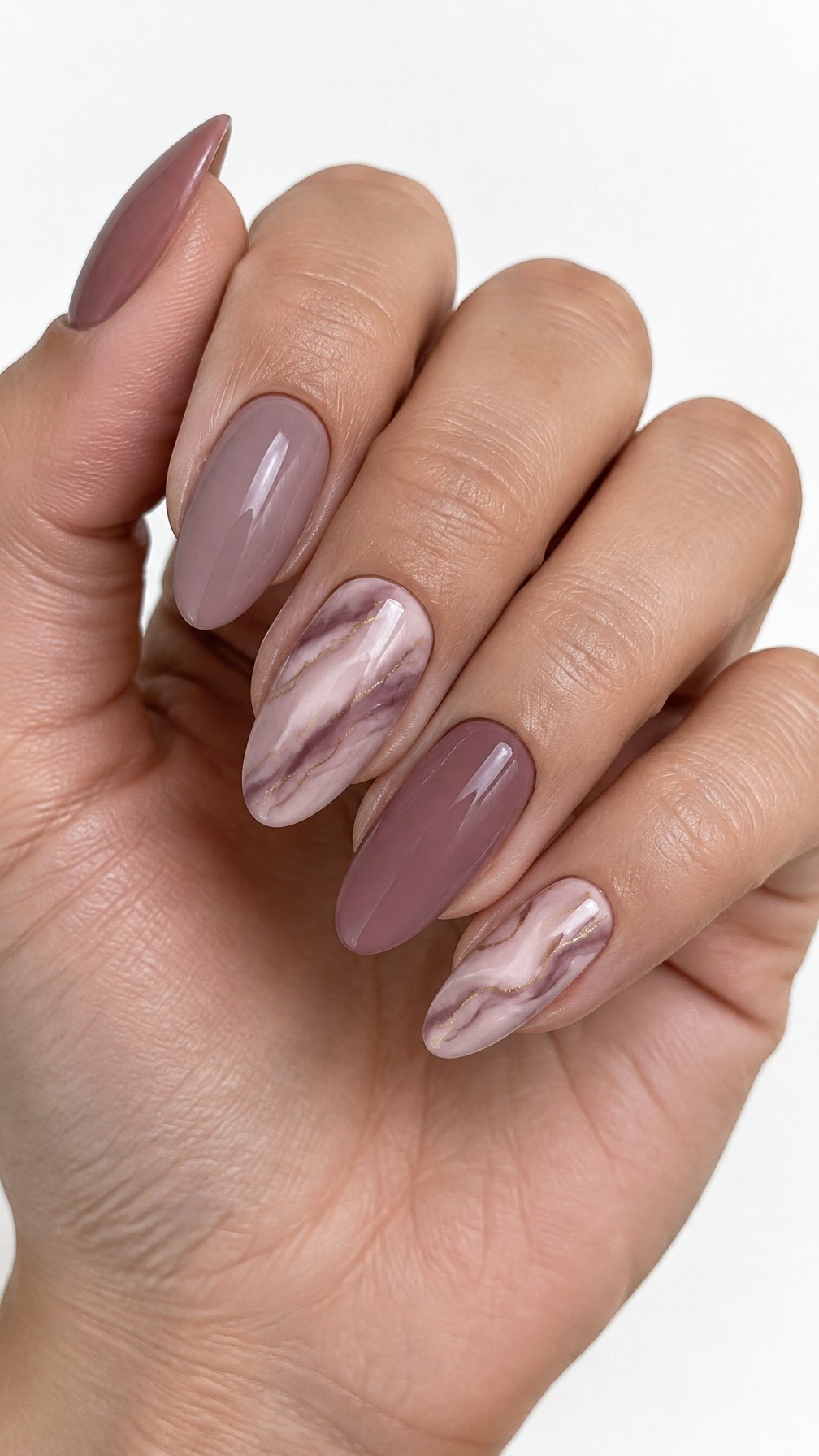 Glossy mauve marble nails with delicate gold veins