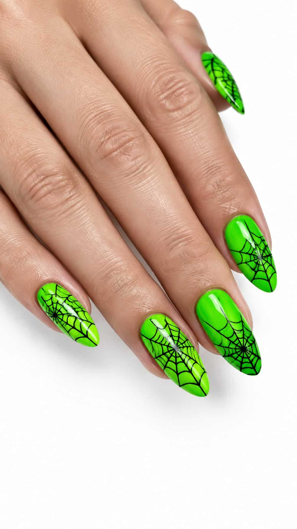 Glossy neon green nails decorated with black spider web designs
