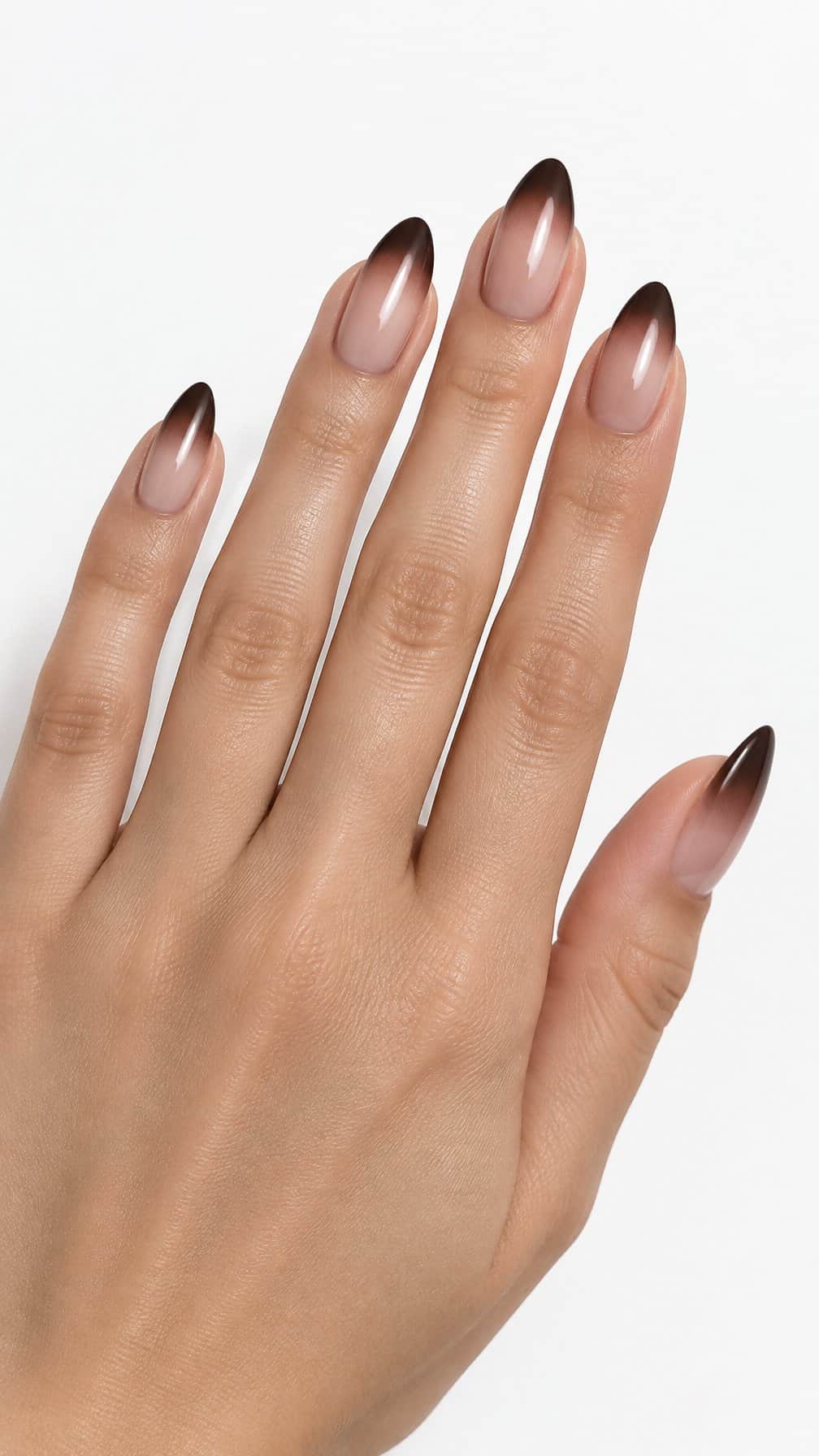 Almond-shaped nails featuring a nude-to-dark brown gradient manicure