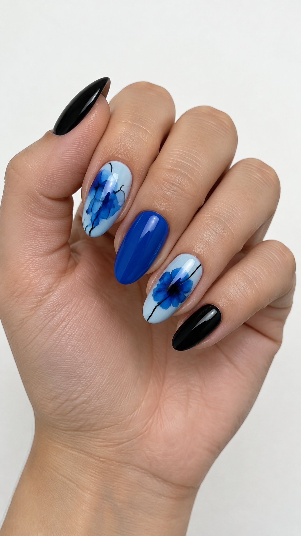 Glossy blue and black painted nails