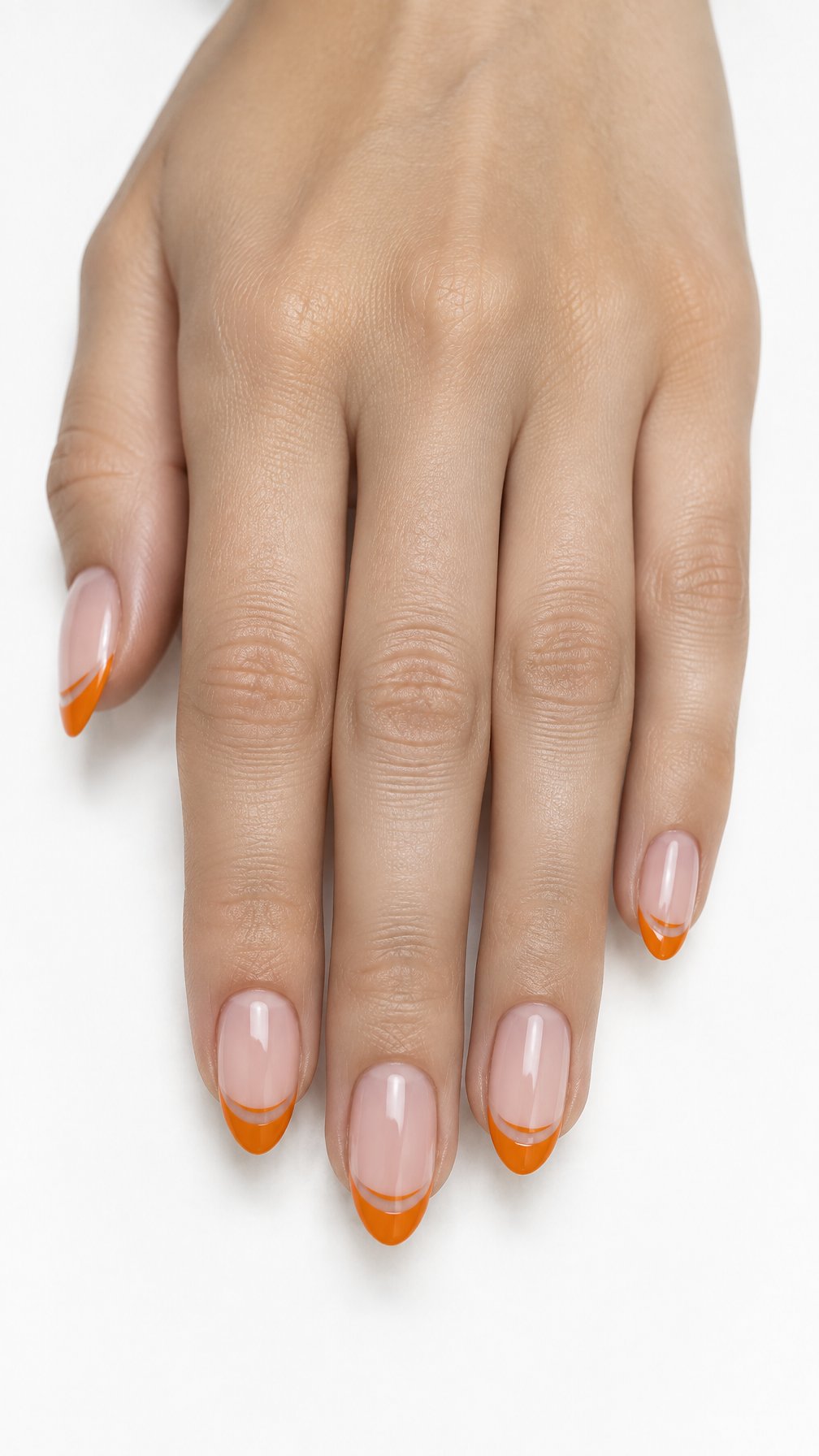 Glossy nude nails featuring bright orange French tips