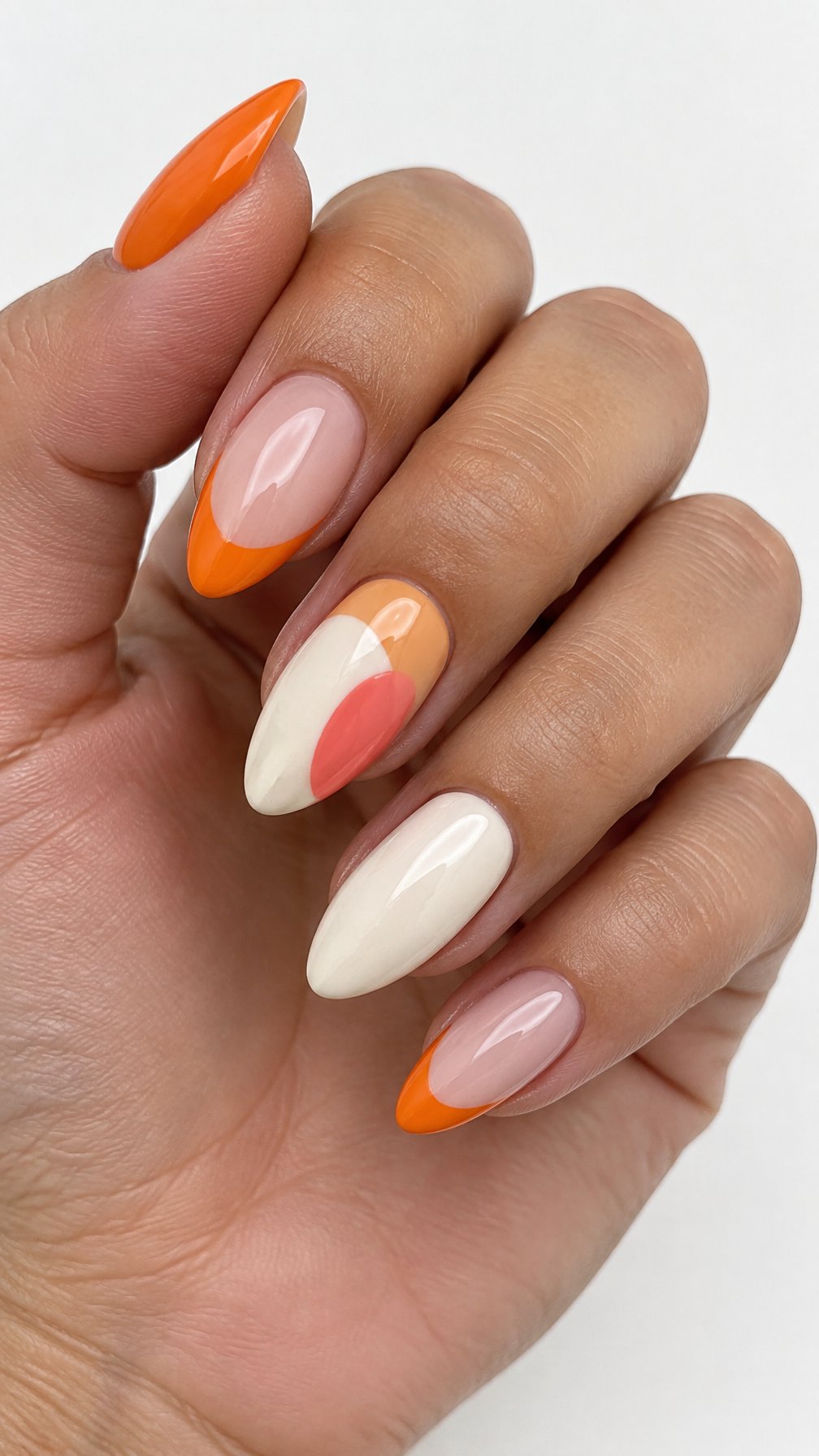 Glossy orange French tip nails and simple abstract color-block designs