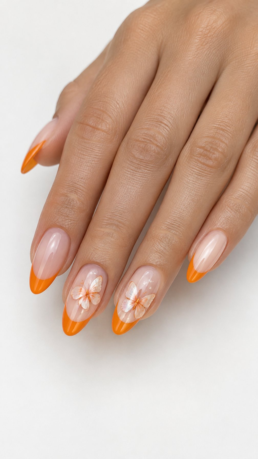 Glossy orange French tip nails and small butterfly designs rests