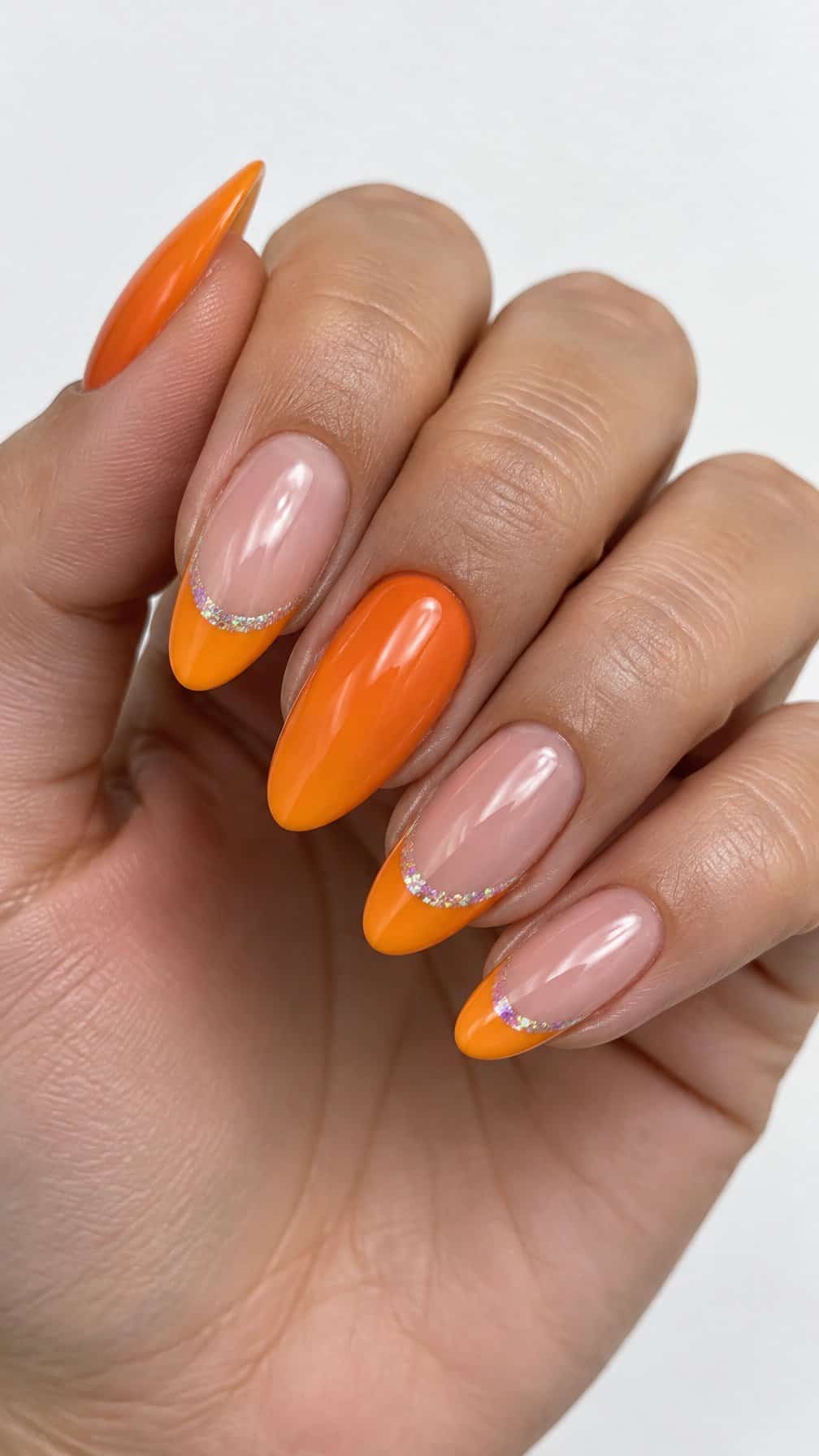 Glossy orange French tip nails rests