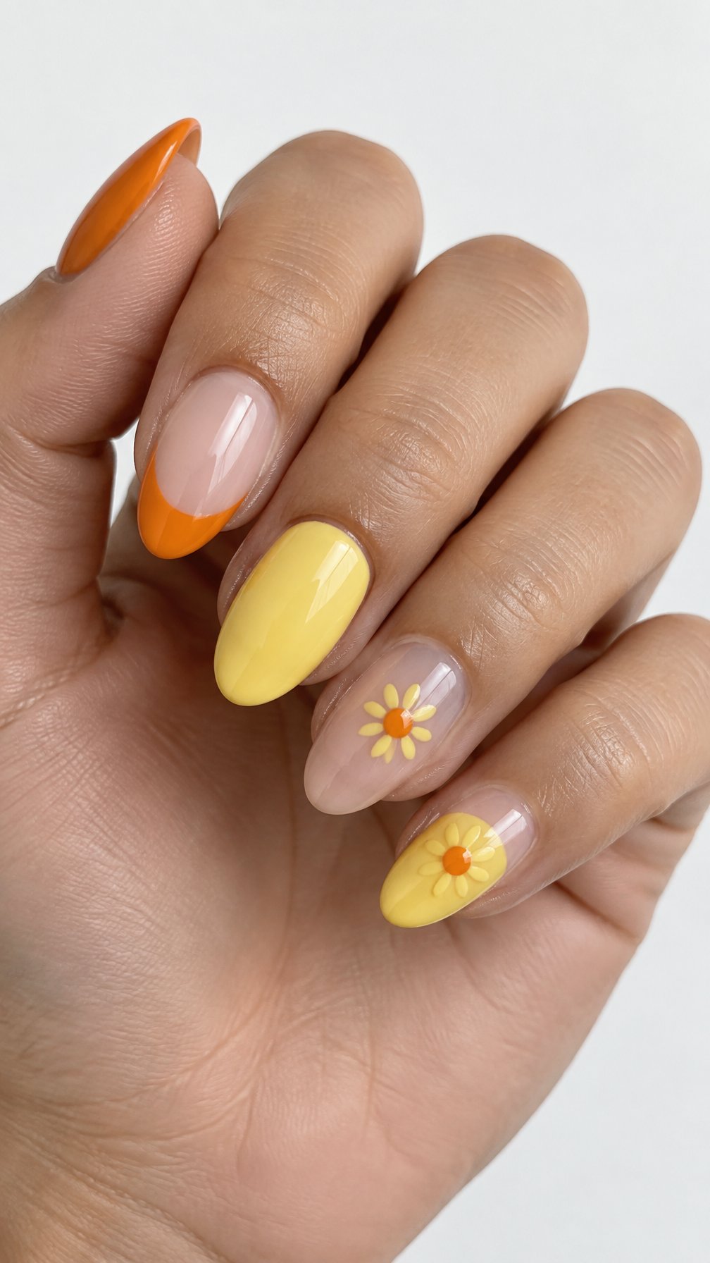 Orange French tip nails and small yellow sunflower designs