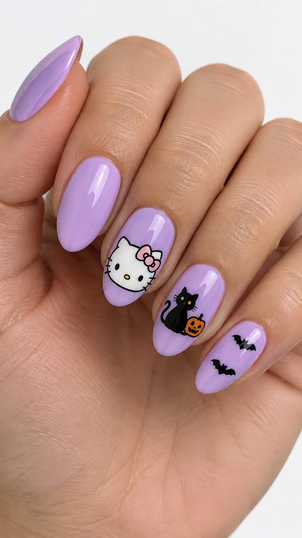 Glossy pastel purple Halloween-themed nail art