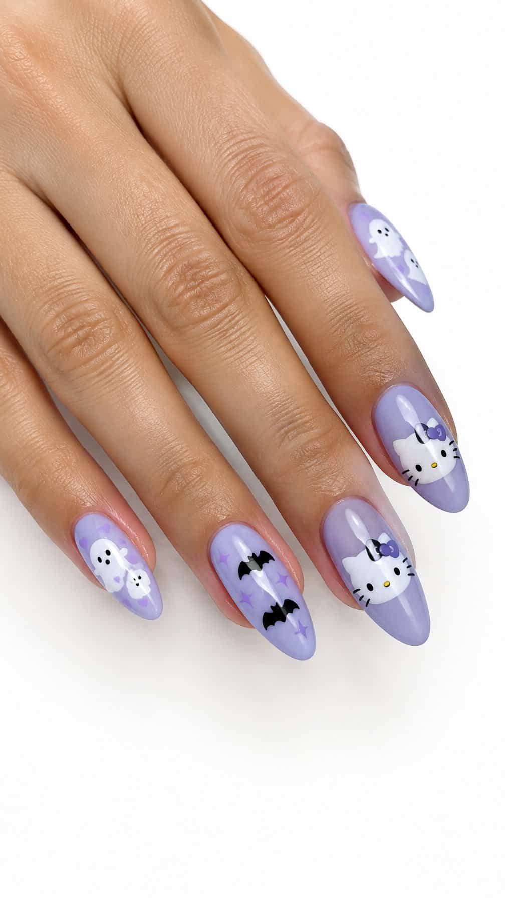 Glossy pastel purple Halloween nail art featuring ghosts, bats, and Hello Kitty-inspired designs