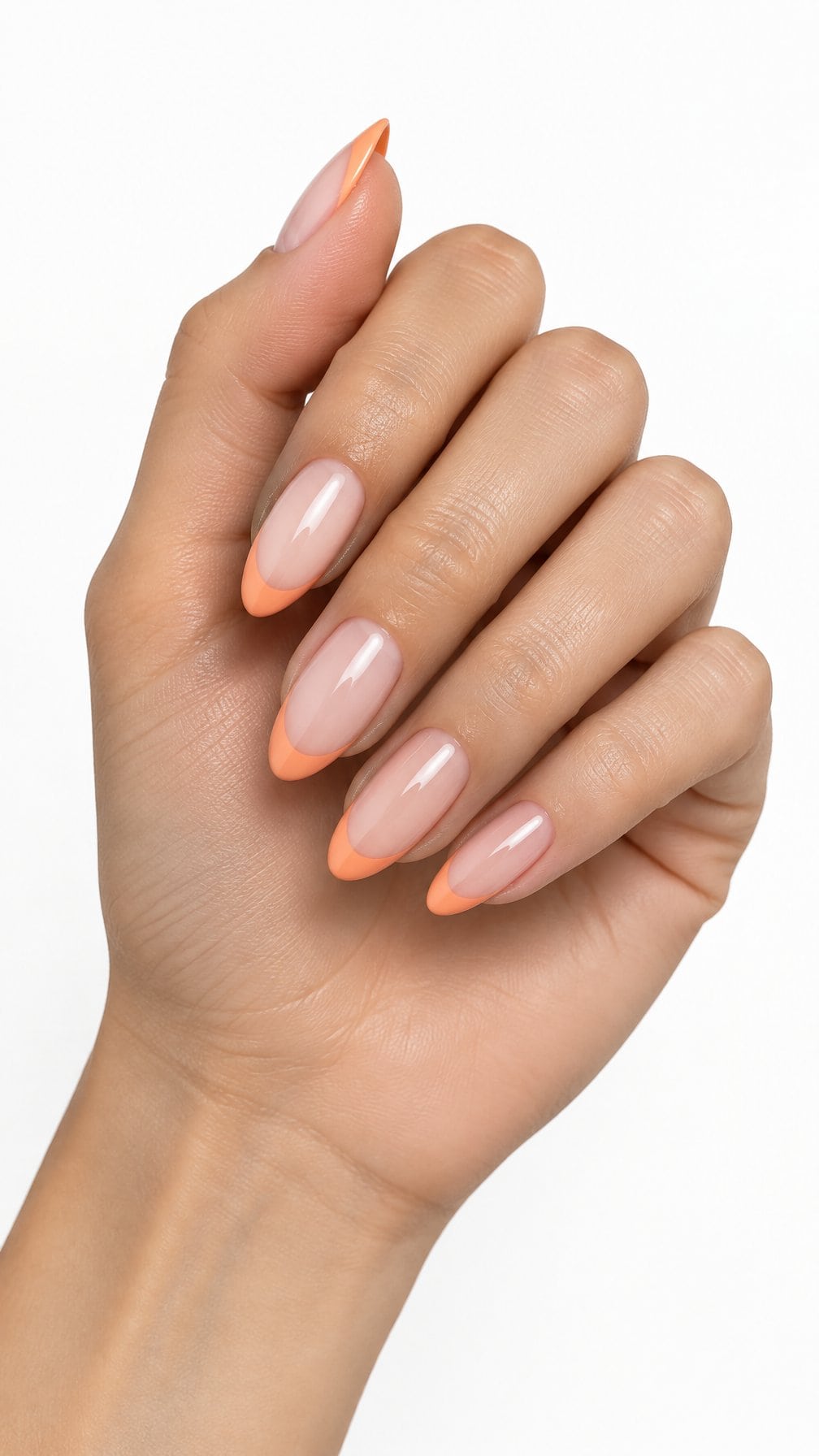 Almond-shaped nails featuring glossy peach-orange French tips