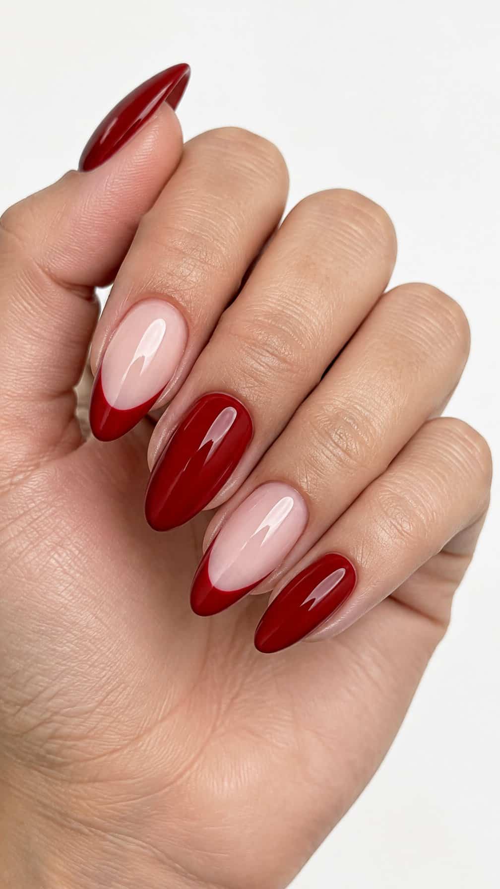 Glossy red French-tip gel nails