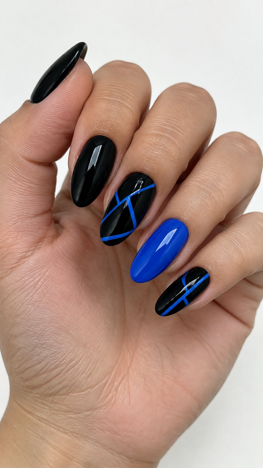Glossy black and electric blue geometric gel nails