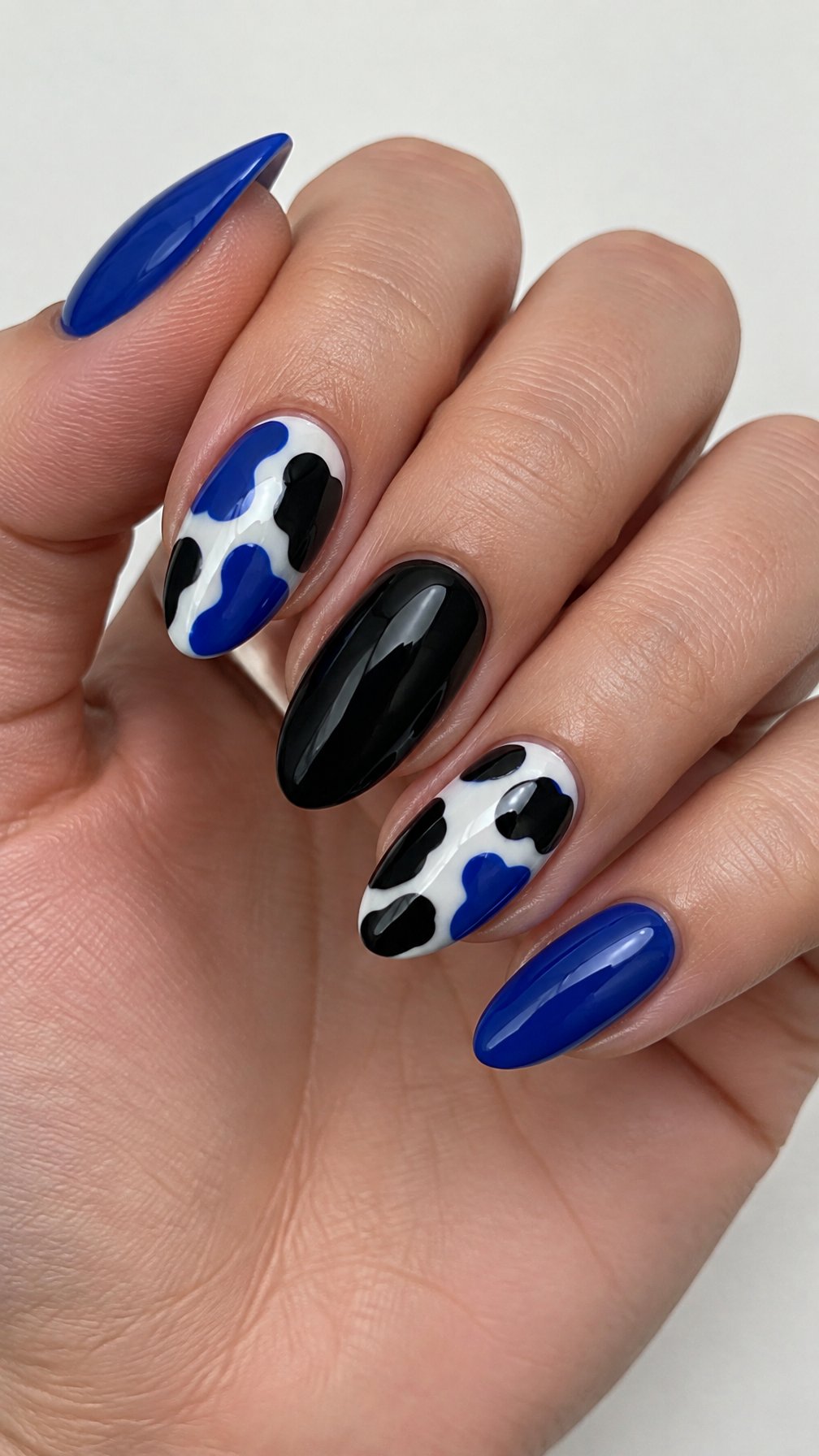 Glossy black and blue patterned gel nails
