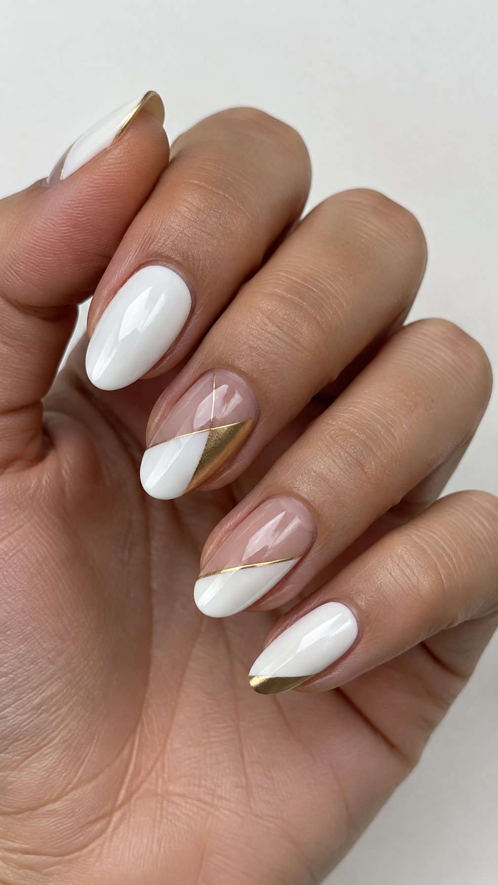 White and gold geometric nail designs
