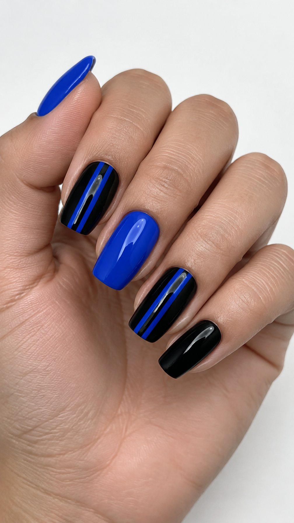 Glossy black and blue vertical stripe nails