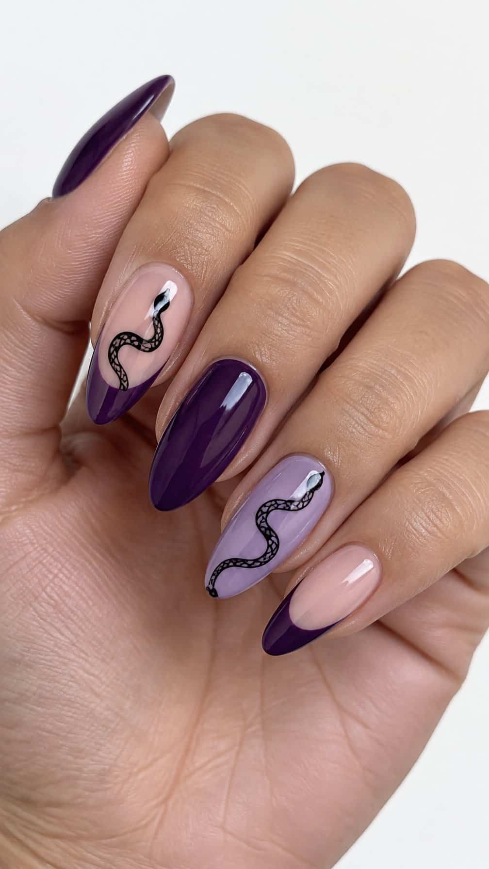 Glossy purple French tip nails and black snake details