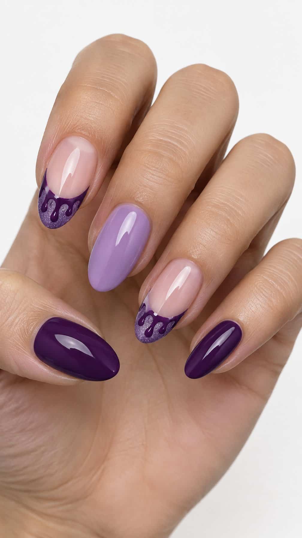 Glossy purple French tip nails with glitter and drip designs