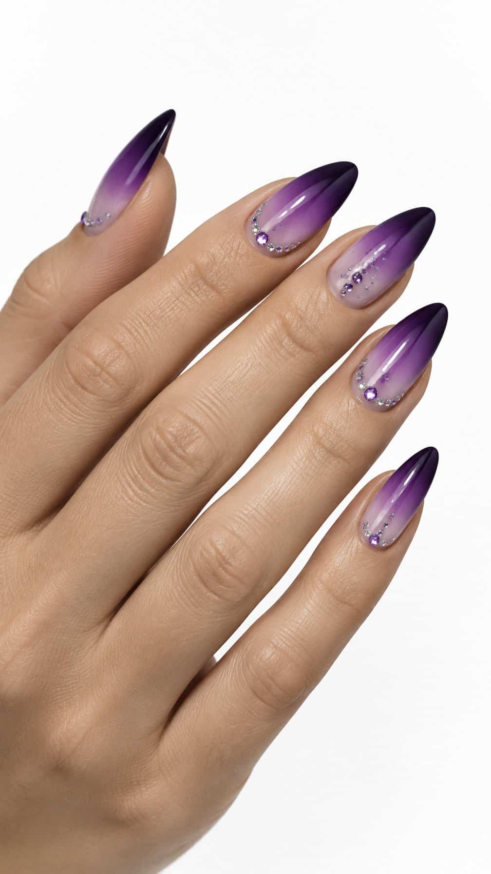 Glossy purple ombré nails and small rhinestone accents