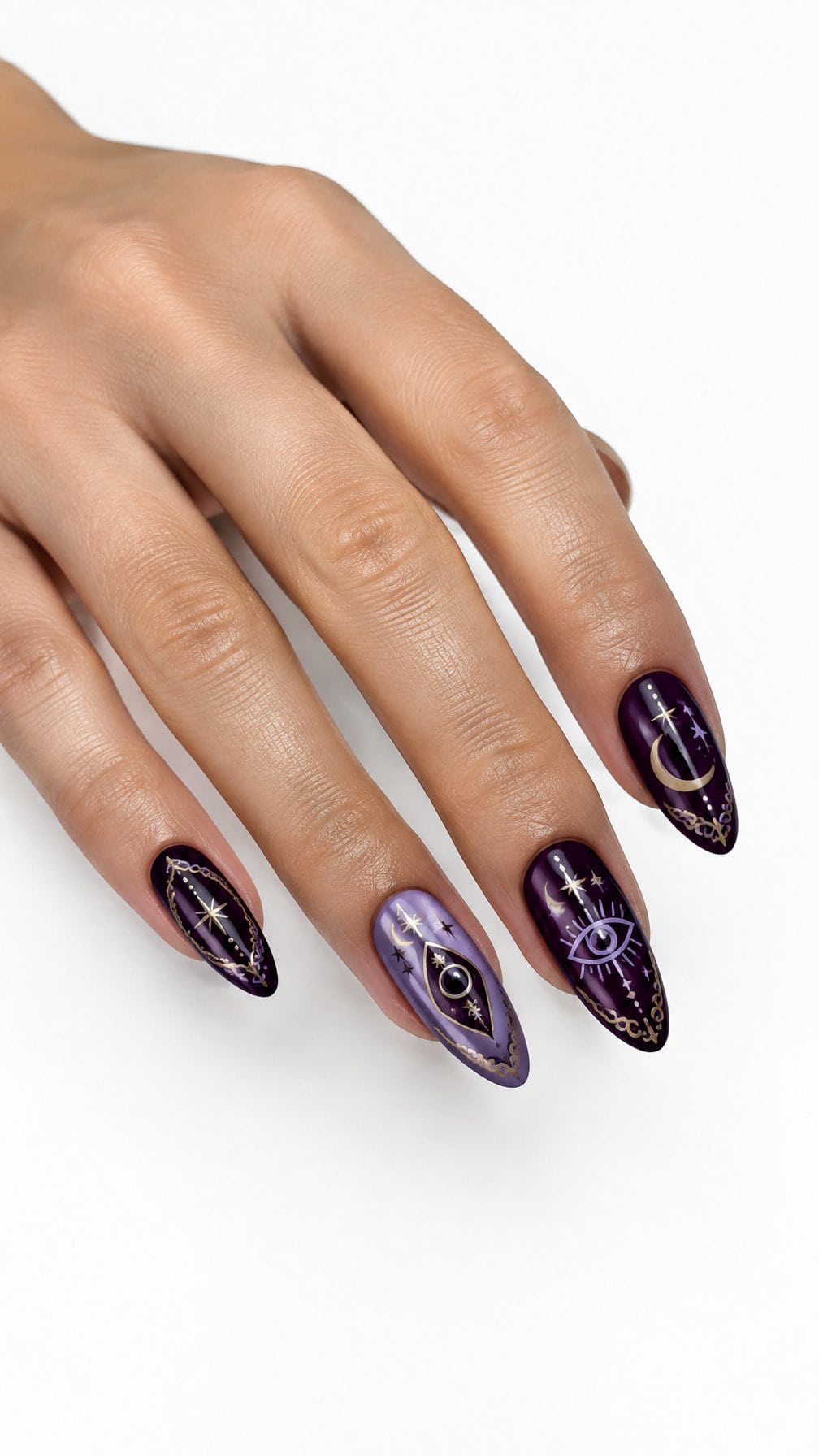Glossy purple nails decorated with small mystical moon, star, and planchette designs