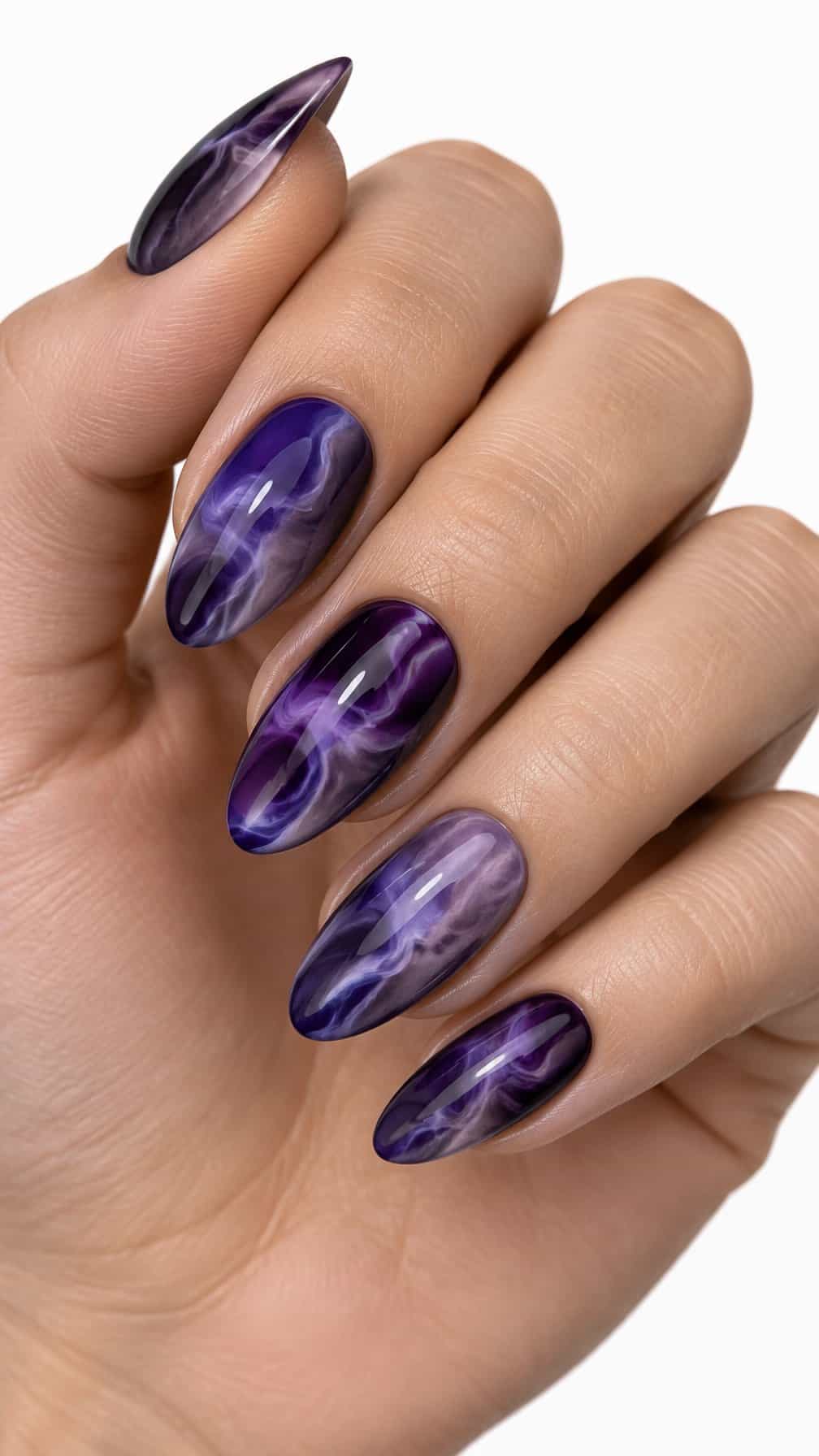 Glossy almond-shaped nails featuring layered purple smoky swirls