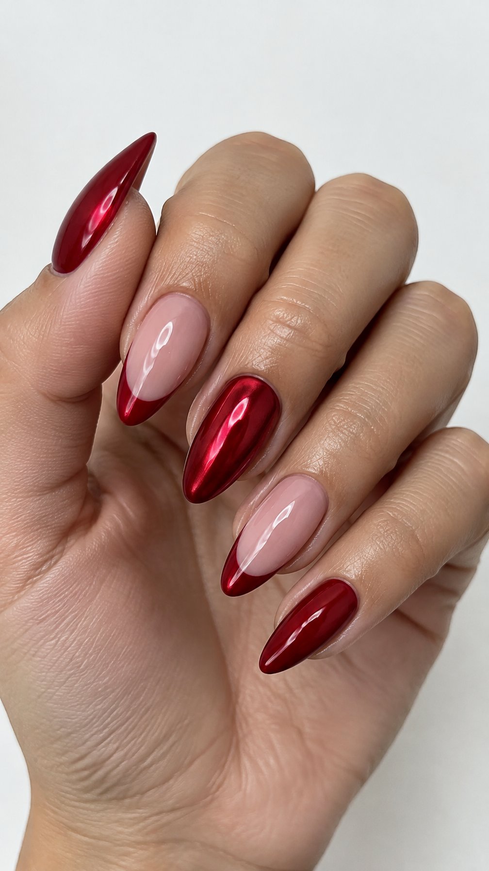 Glossy cherry-red almond-shaped manicured nails