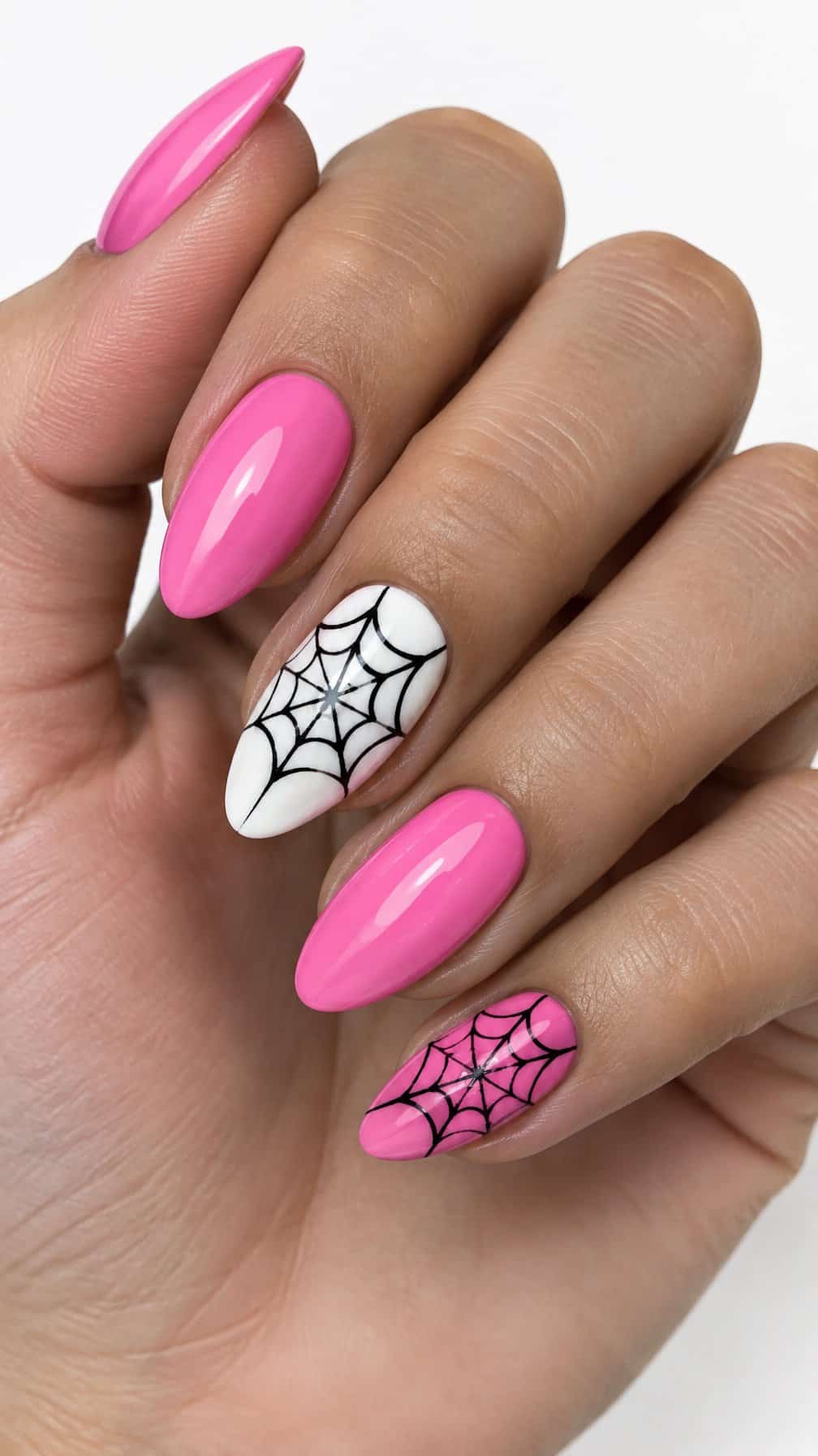 Glossy pink, white, and black spider web nail designs