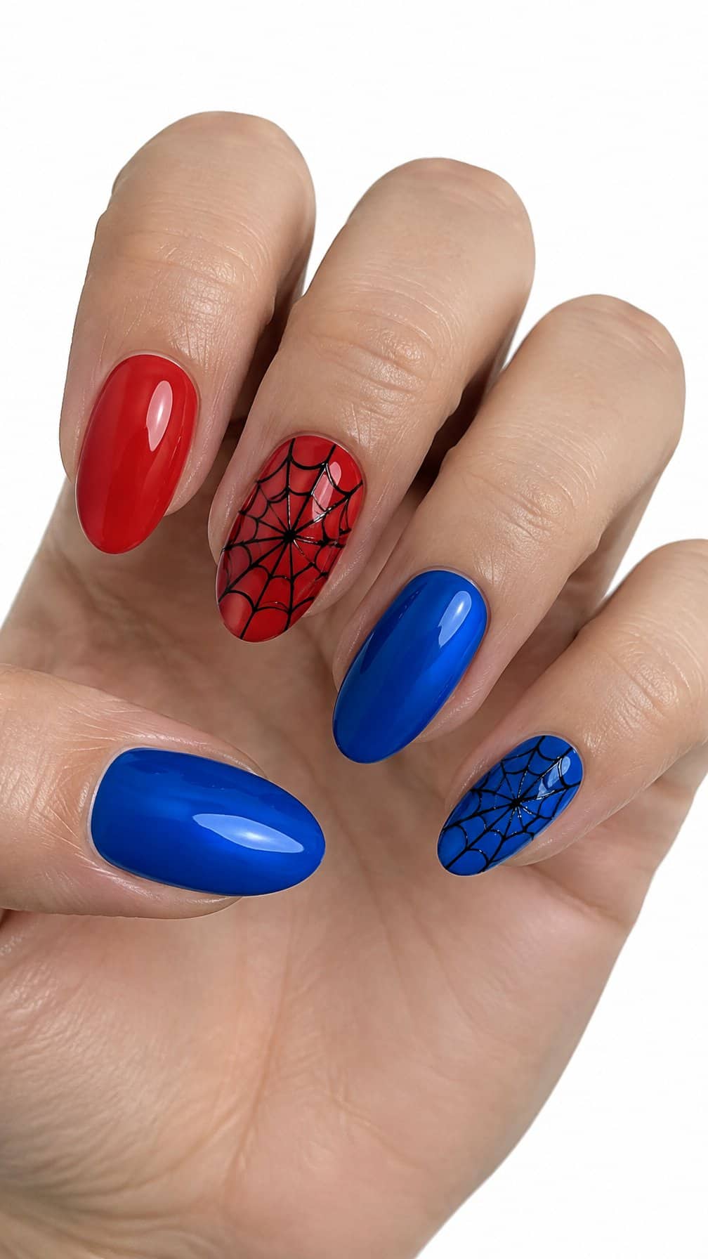 Glossy red-and-blue nails, including black spiderweb designs on accent nails