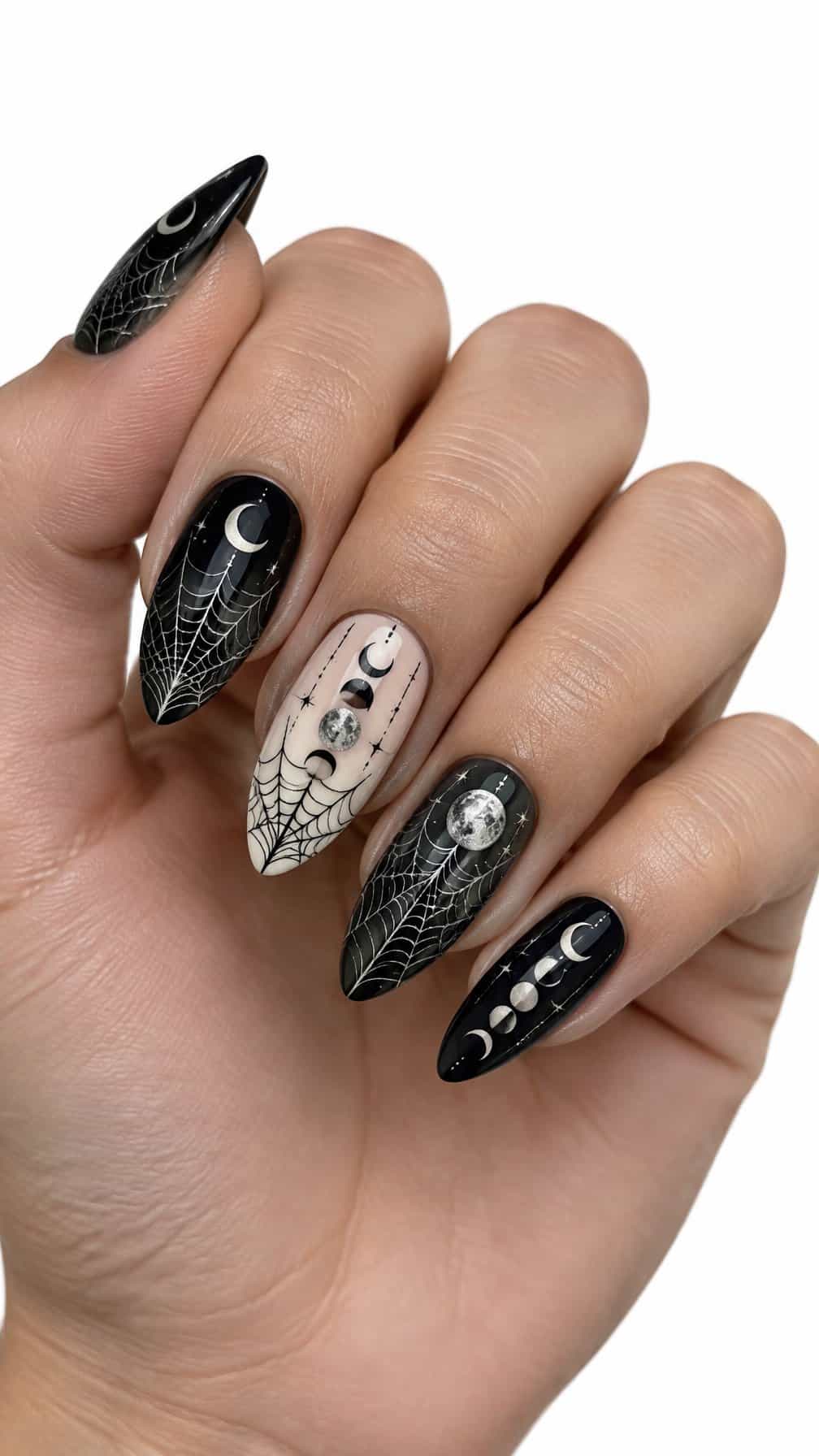 Black and silver spider web and moon phase designs on neatly manicured nails