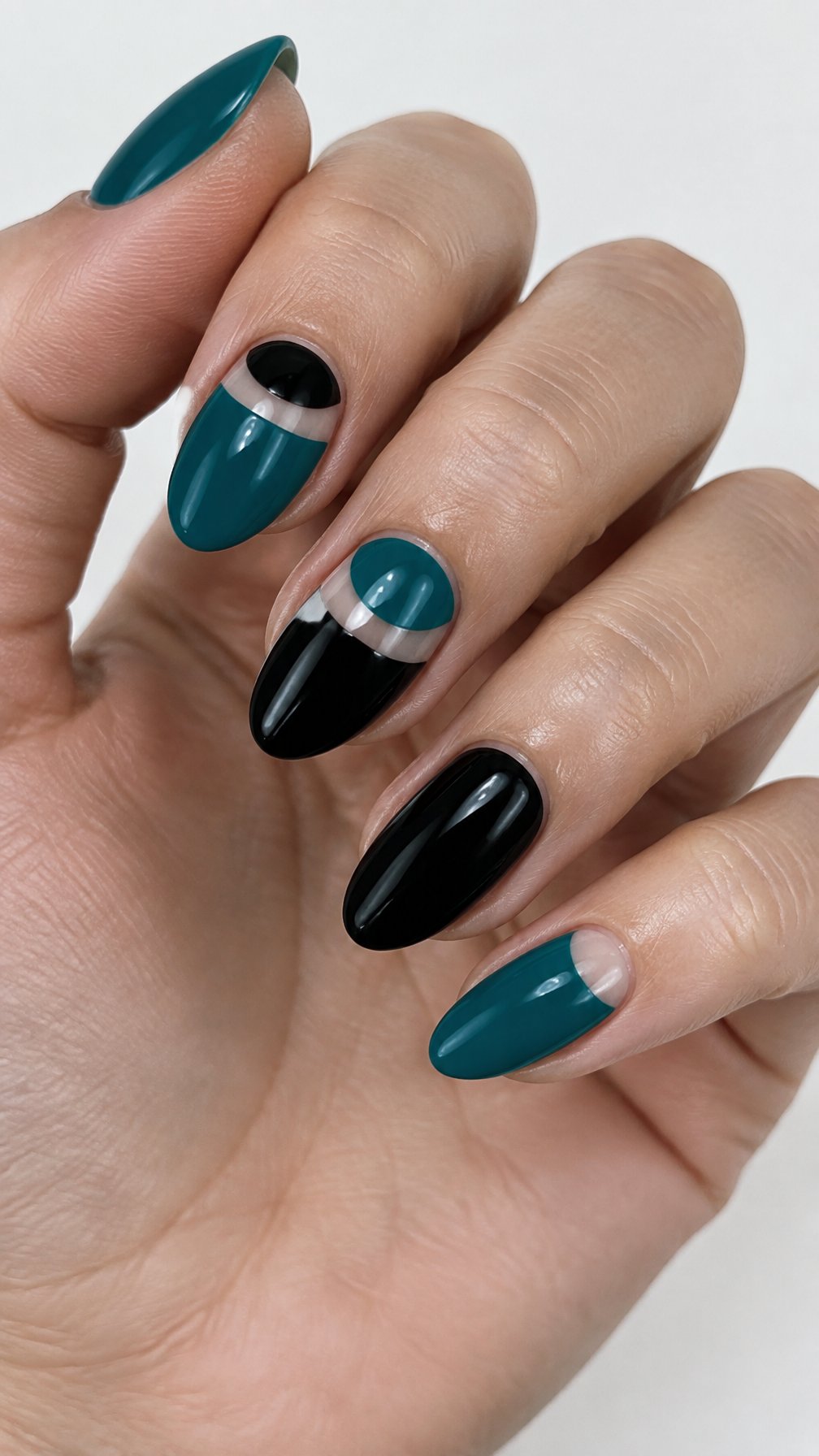 Glossy black and teal half-moon manicure