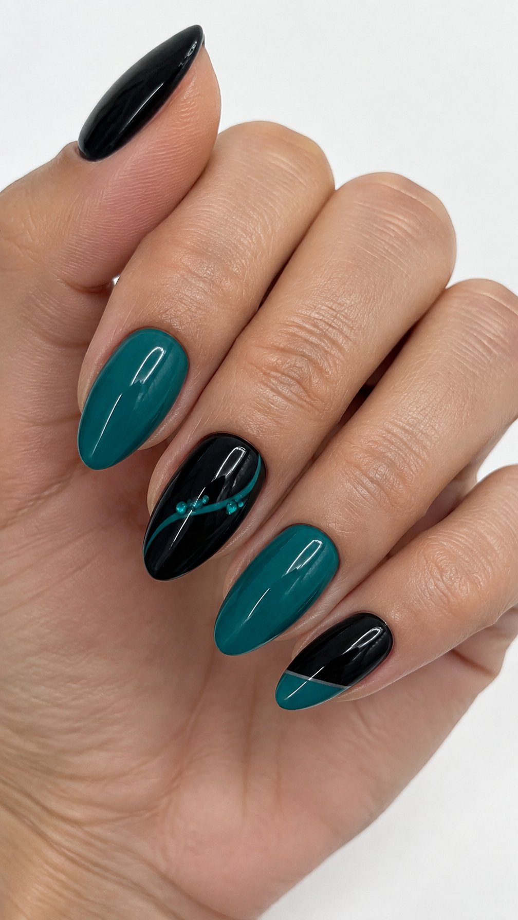 Glossy black and teal manicured nails decorated with small teal accents