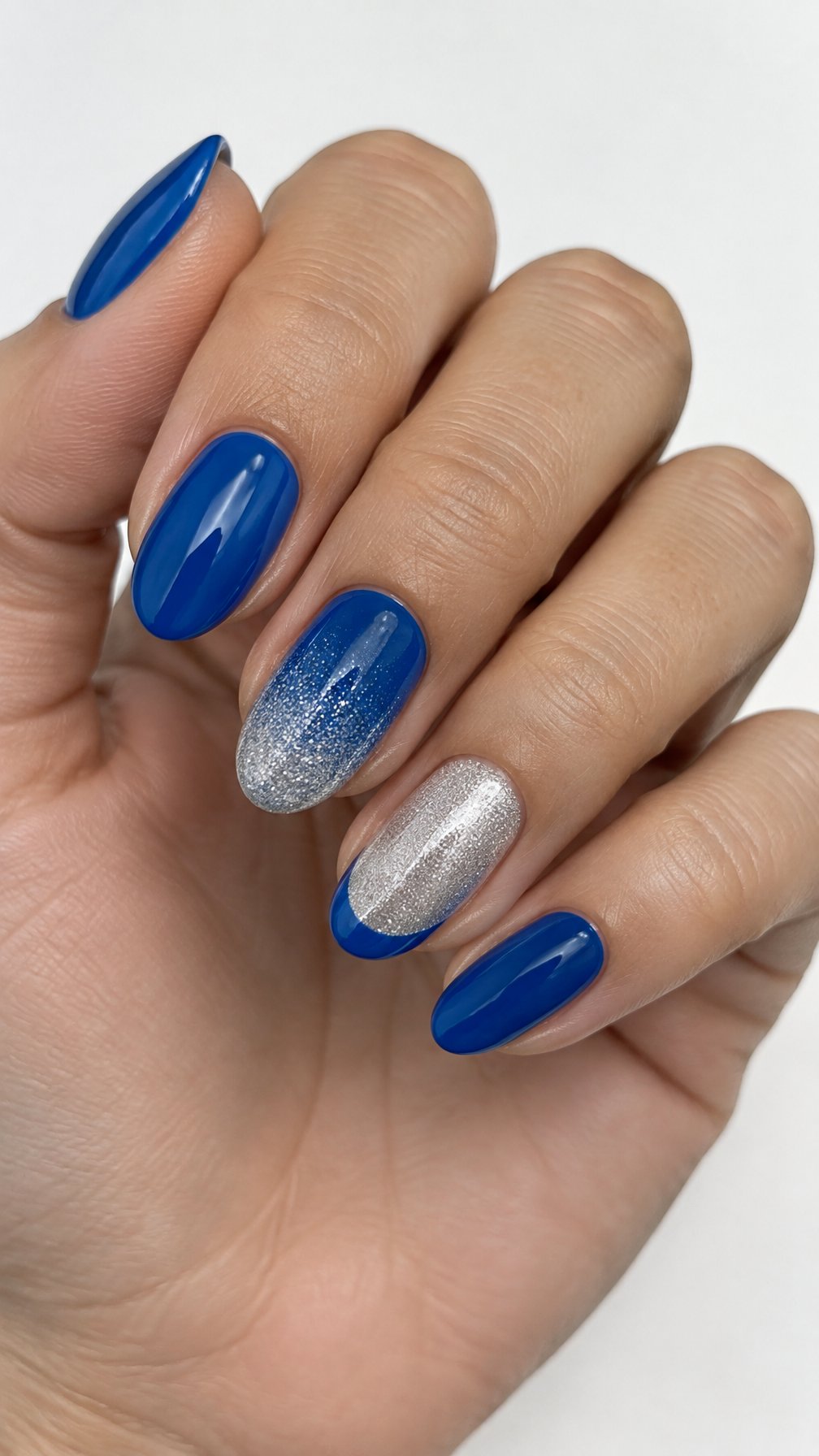 Glossy blue and silver glitter ombre manicure