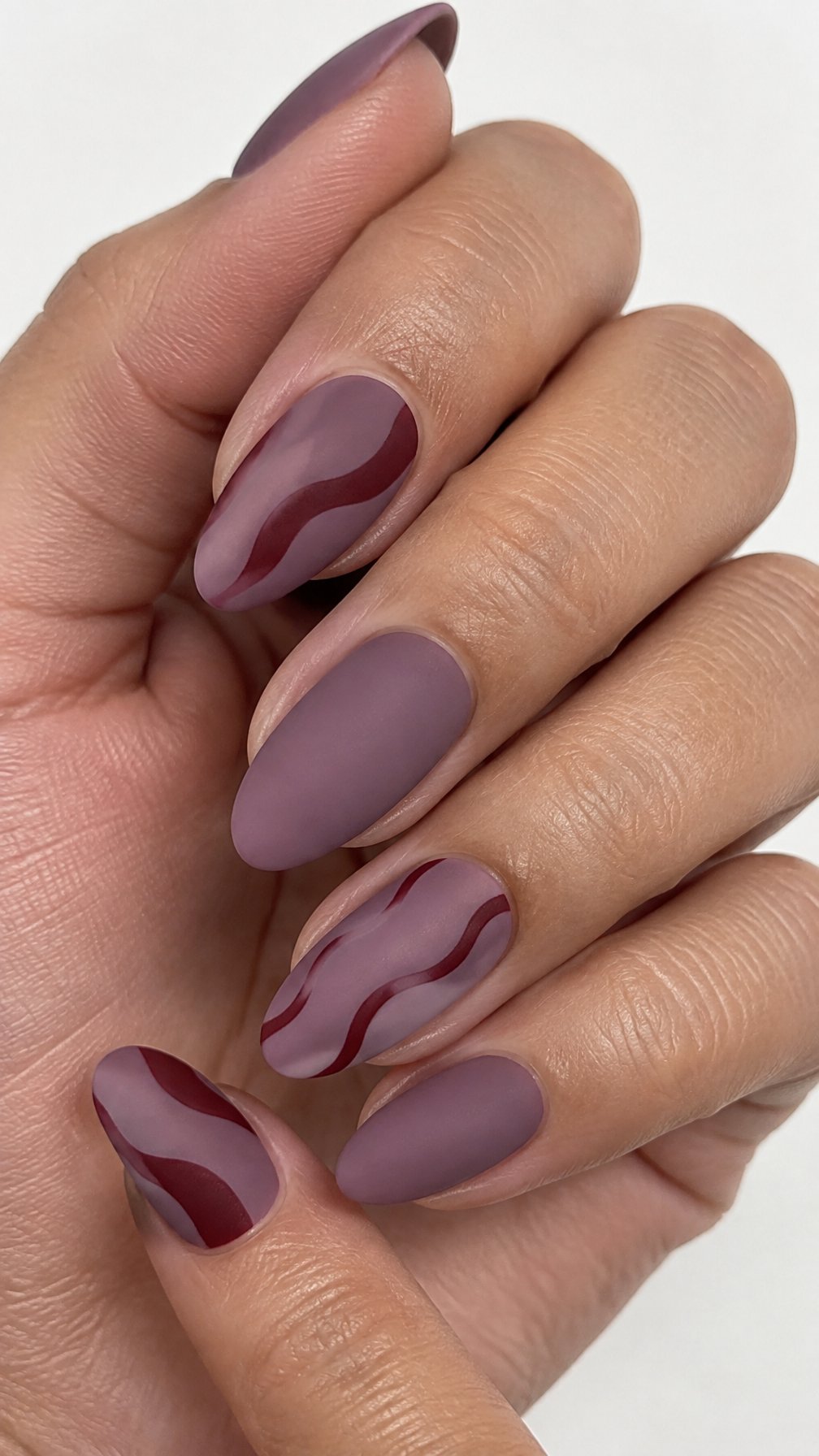Mauve and burgundy abstract wave nail art