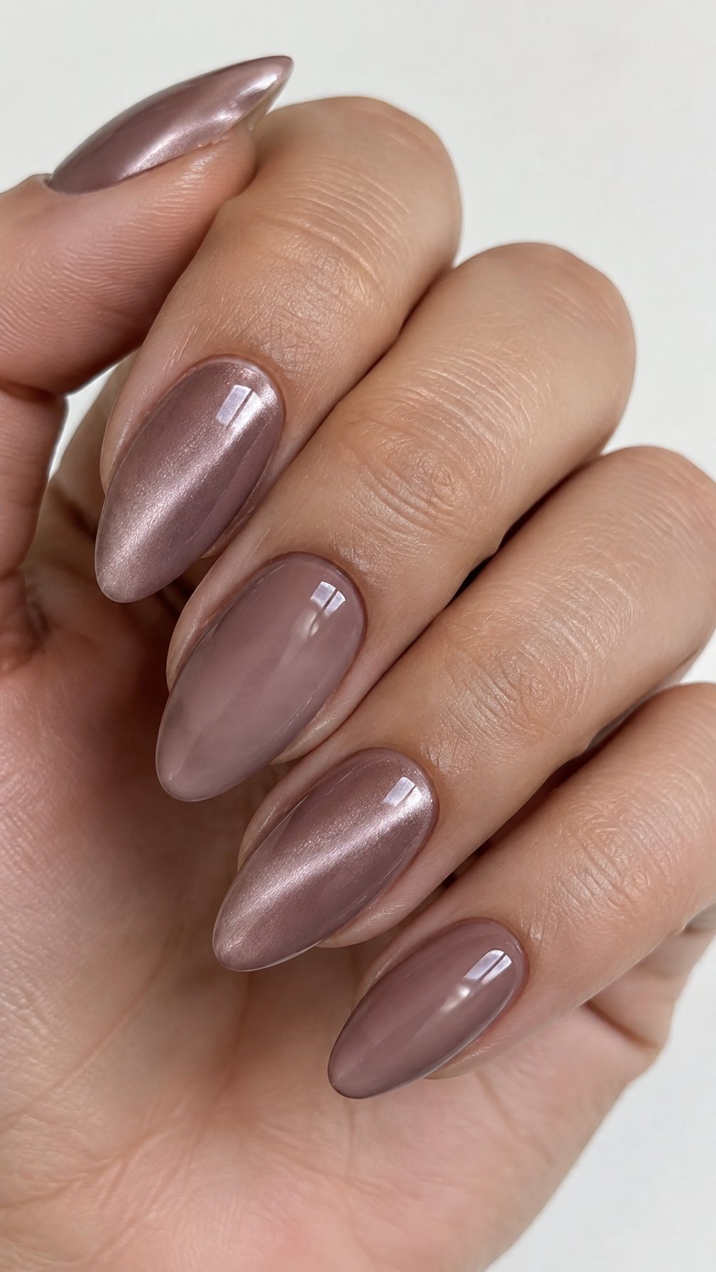 Glossy mauve almond-shaped nails