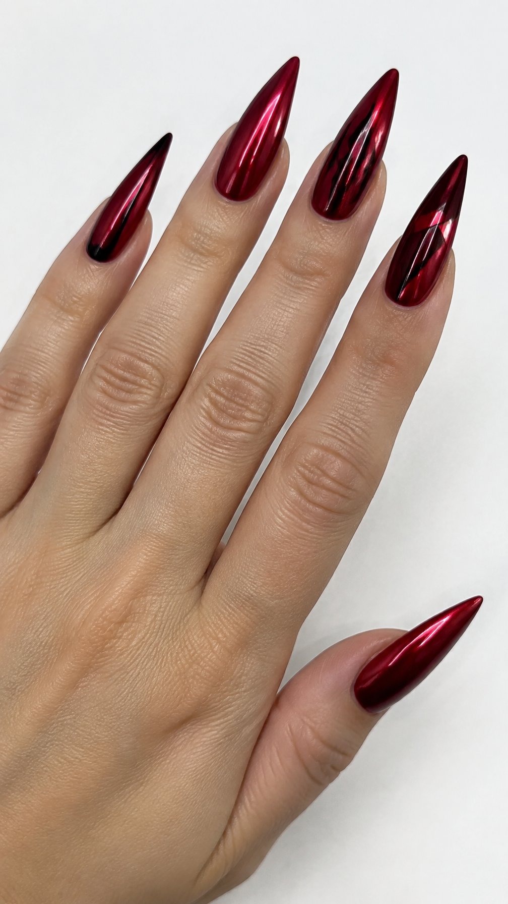 Long dark red stiletto-shaped manicured nails