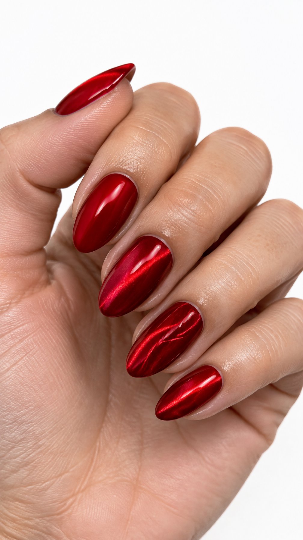 Glossy red almond-shaped manicure nails
