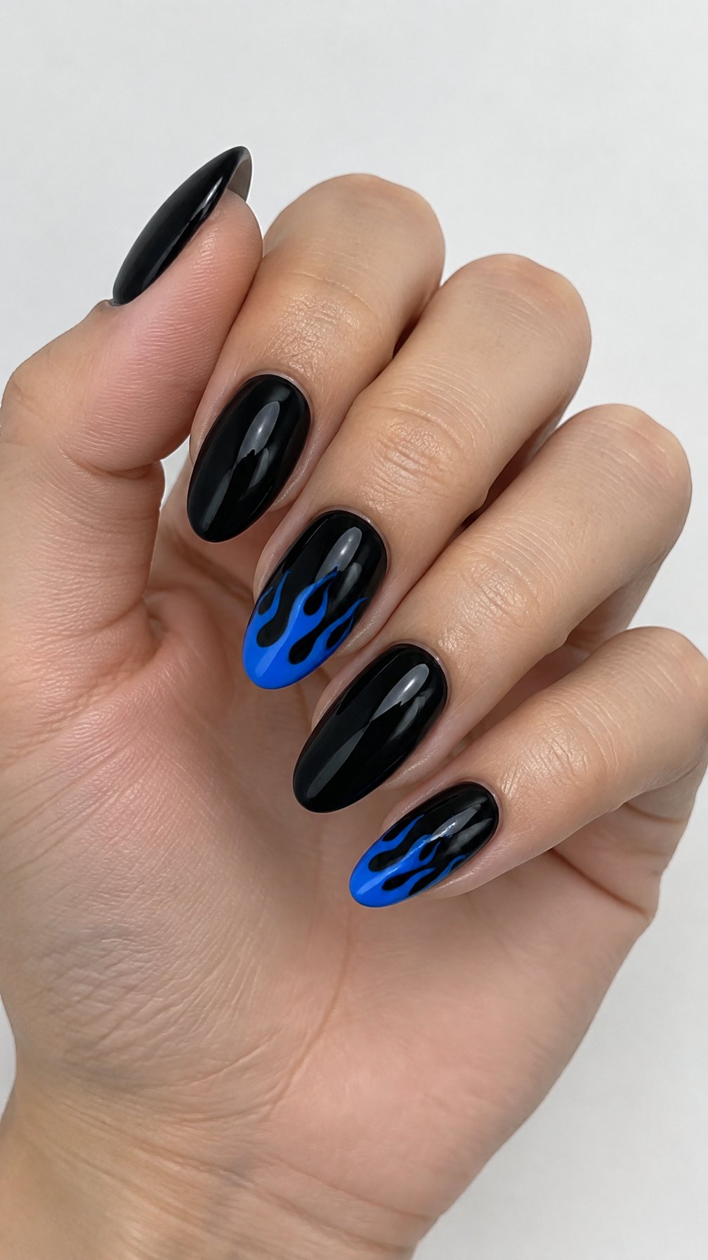 Glossy black nails and sapphire blue flame tips