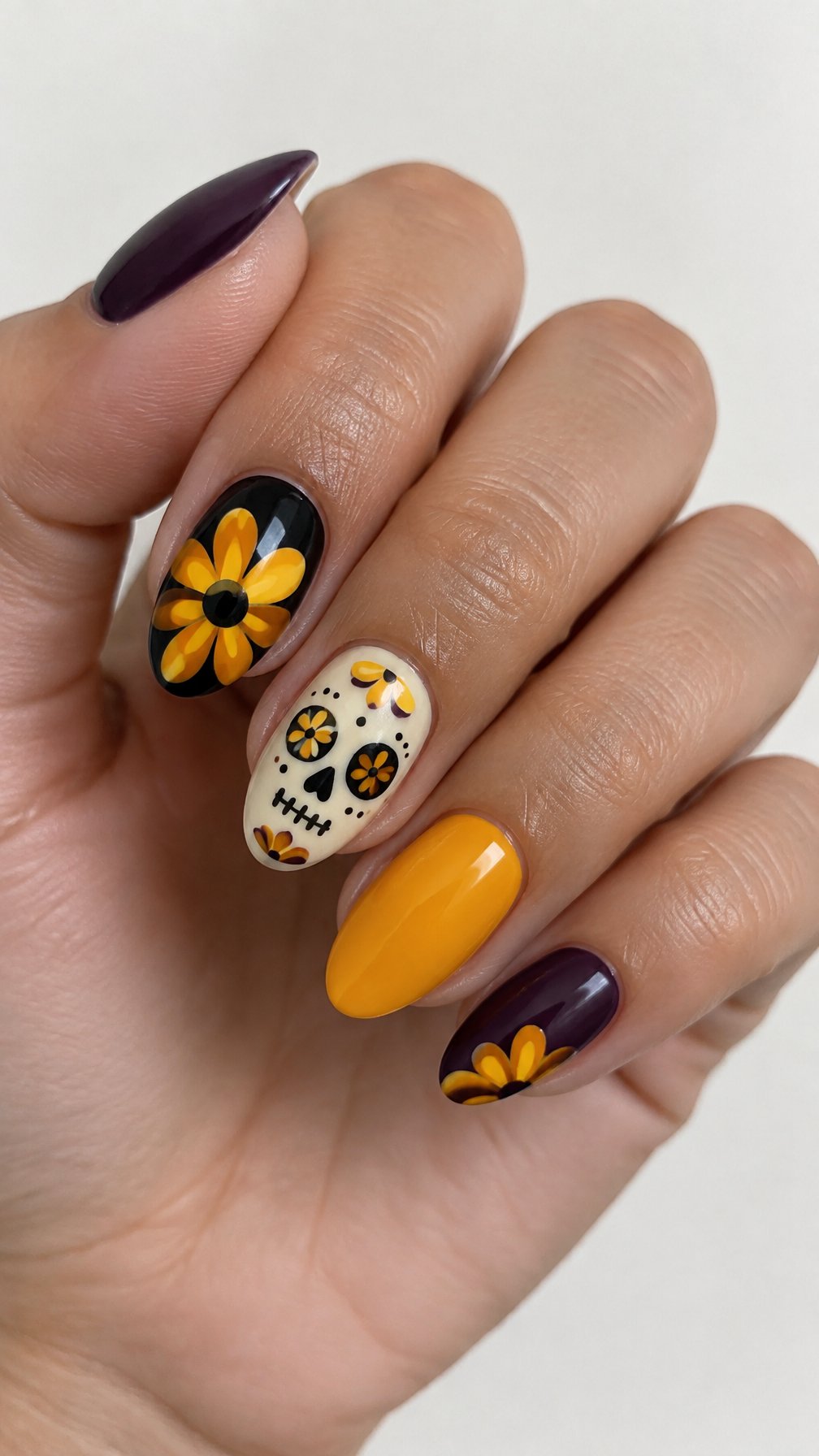 Purple, marigold, and sugar skull nail art