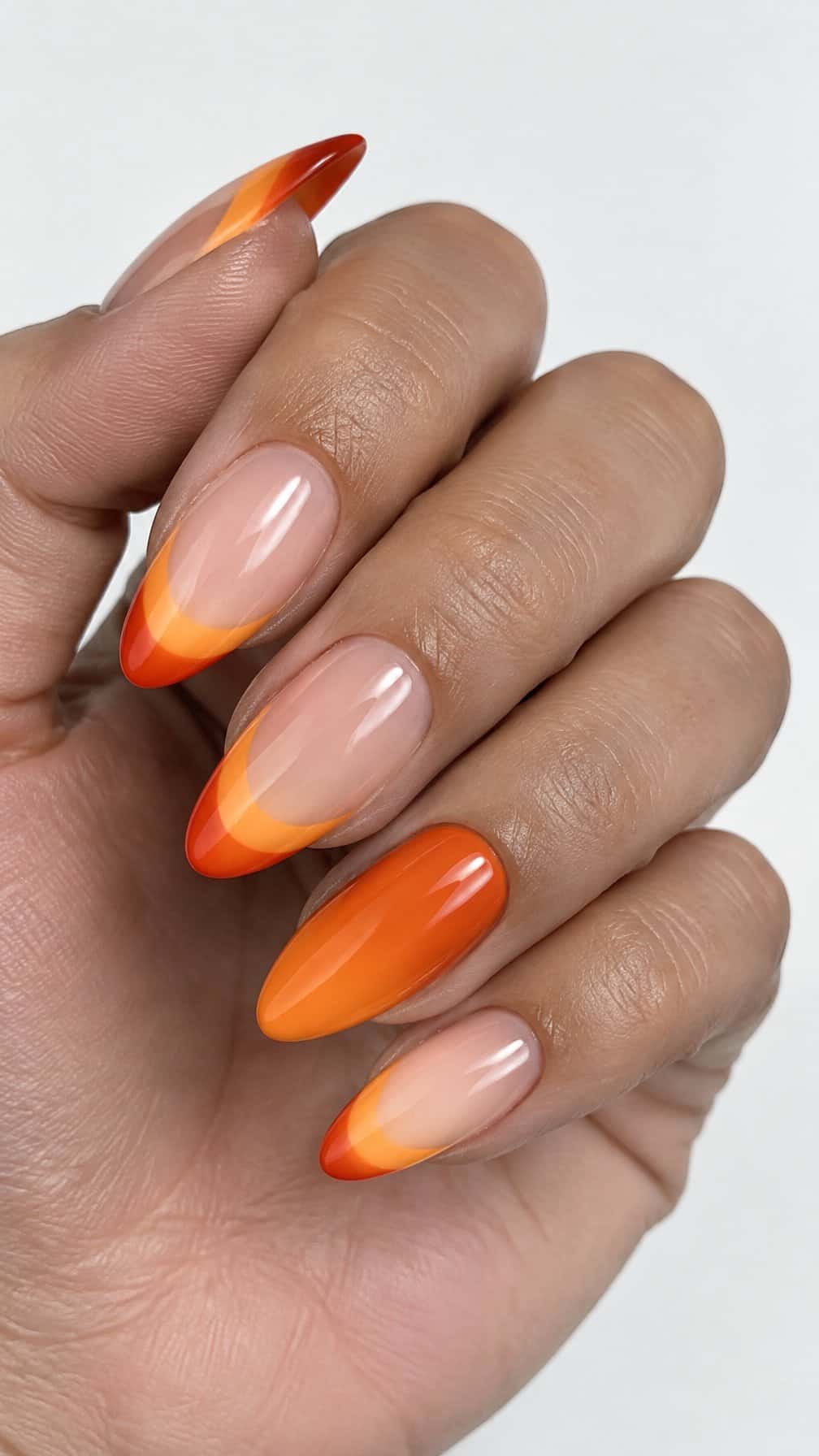 Glossy orange ombre French tip nails