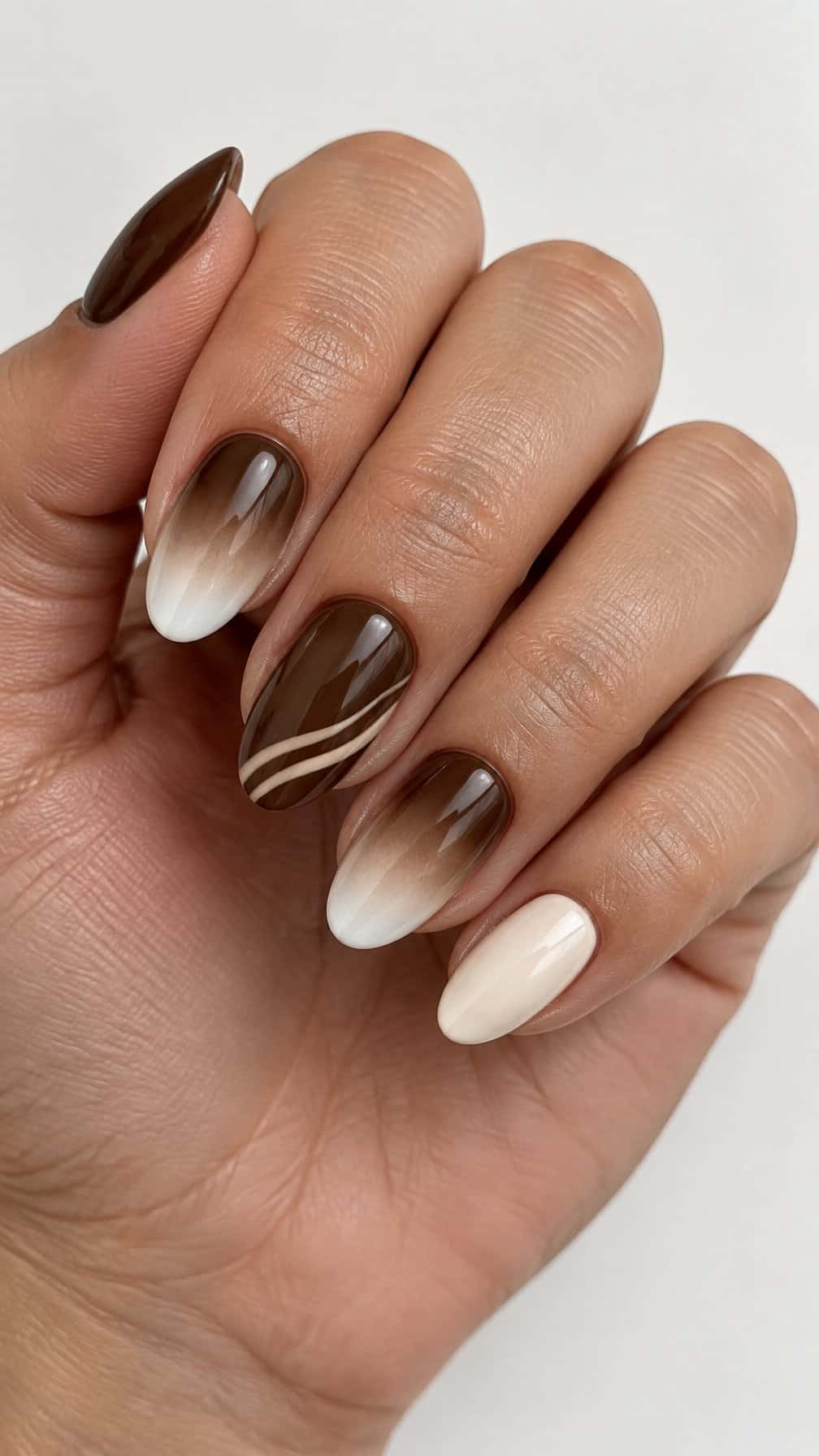 Glossy brown-to-cream ombre gel manicure