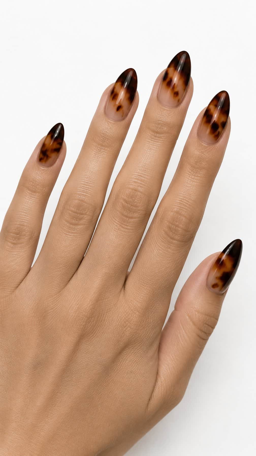 Glossy brown tortoiseshell ombre manicured nails