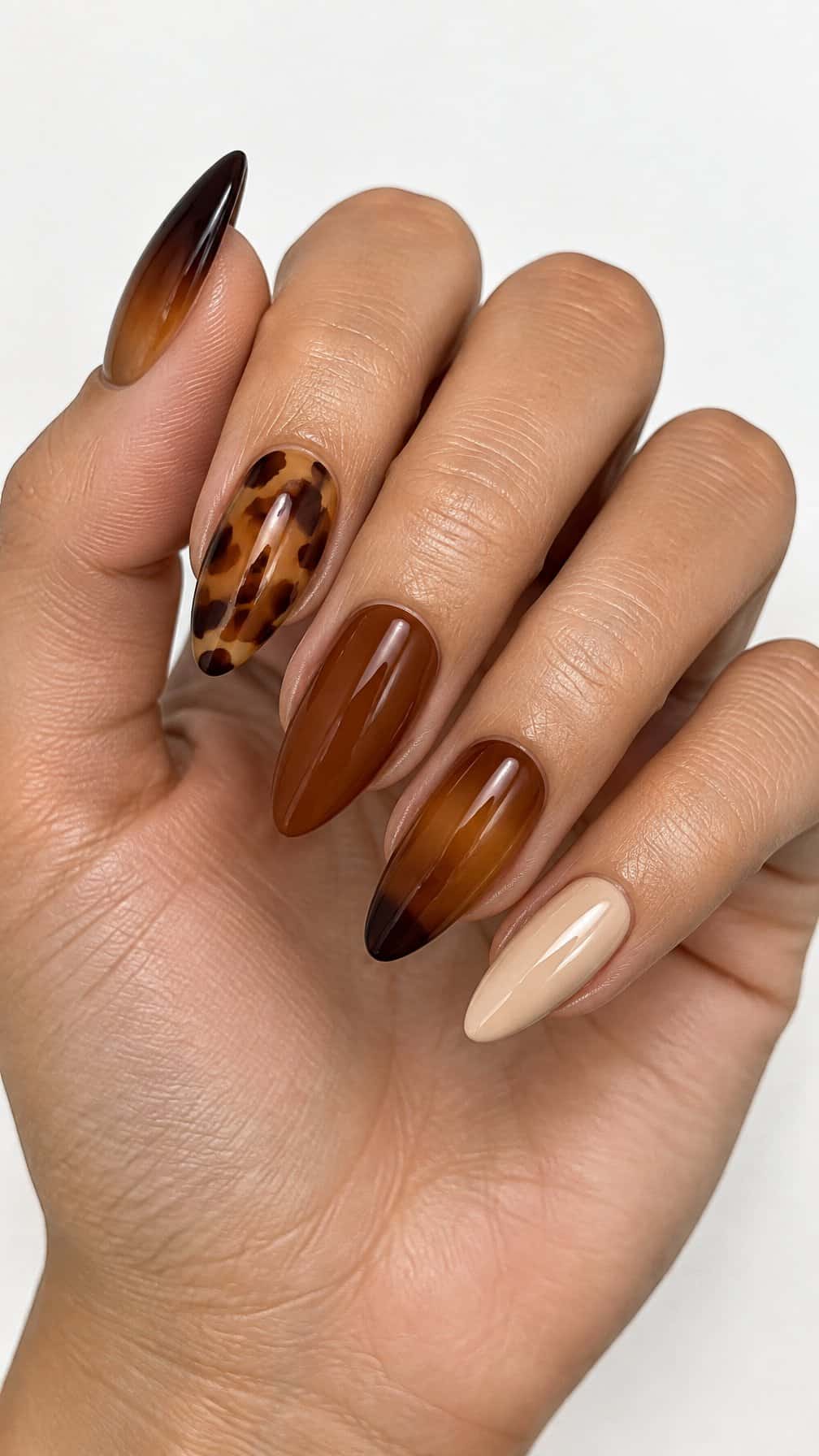 Glossy brown ombre and tortoiseshell manicure
