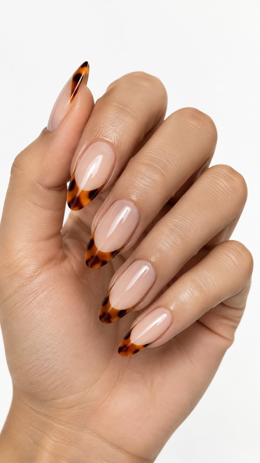 Glossy almond-shaped nails featuring orange tortoiseshell French tips
