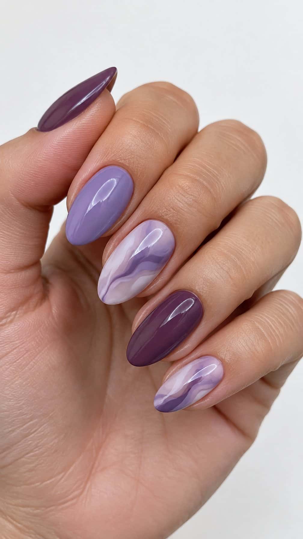 Glossy purple marble-patterned gel nails