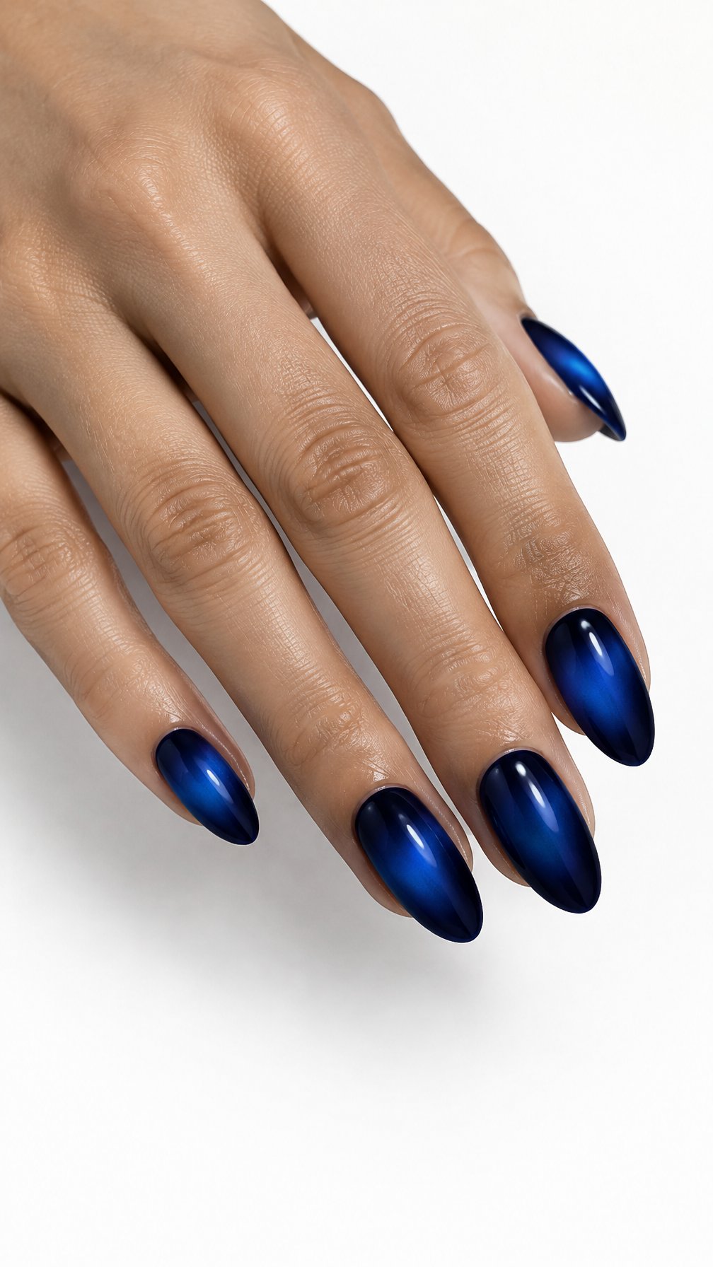 A single hand with glossy midnight blue nails featuring glowing cobalt blue centers on a white background.