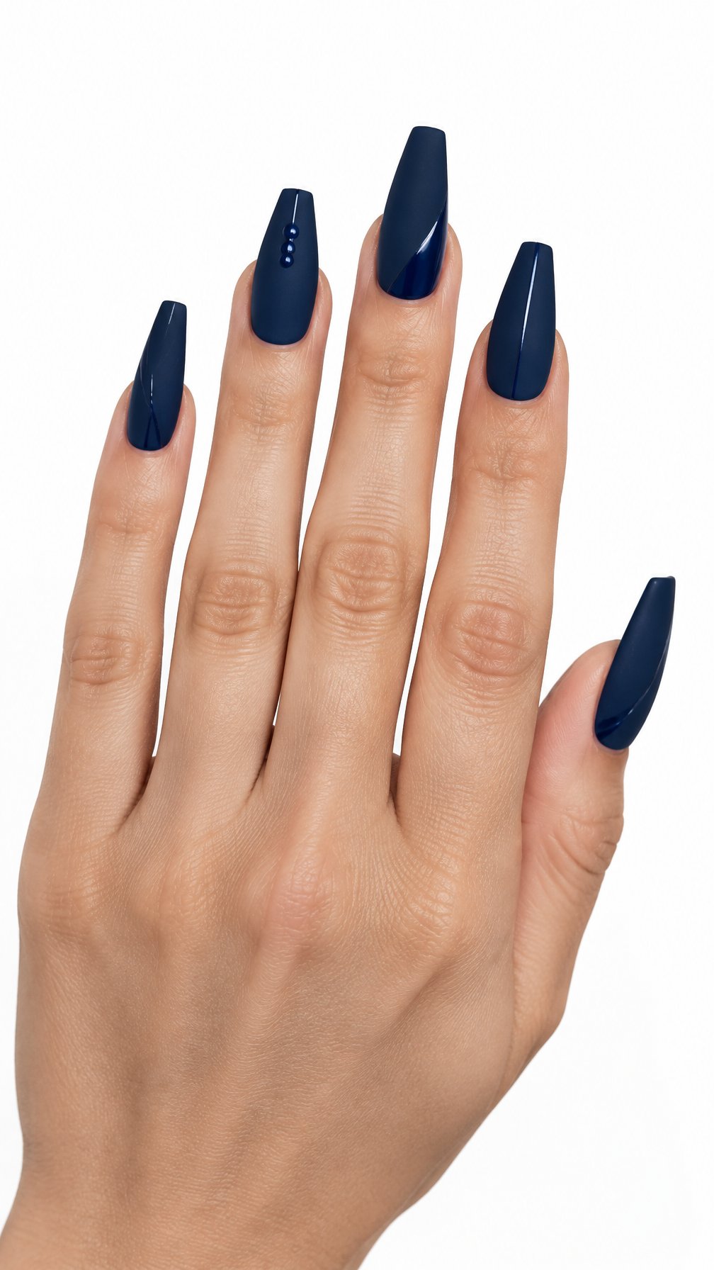 One hand with long matte midnight blue coffin-shaped nails featuring subtle decorative details against a white background.