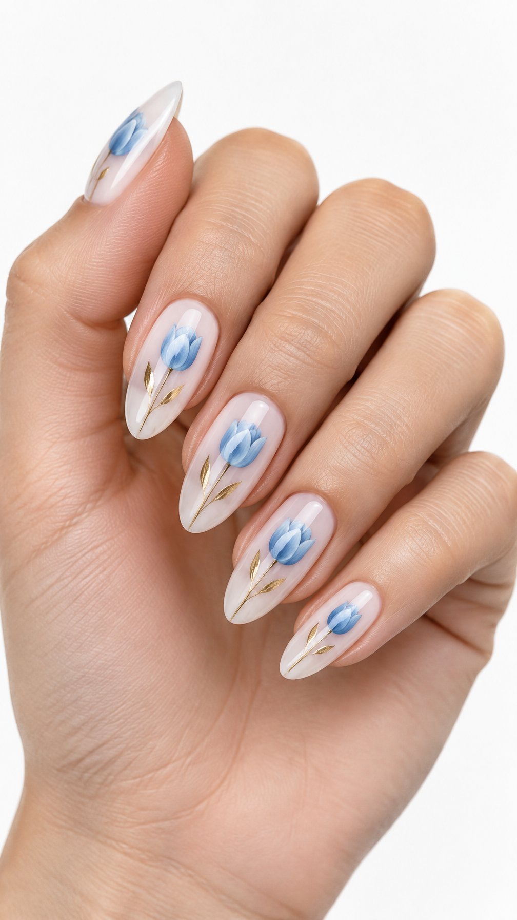 A single hand with glossy white nails decorated with powder-blue tulips and gold stems against a white background.