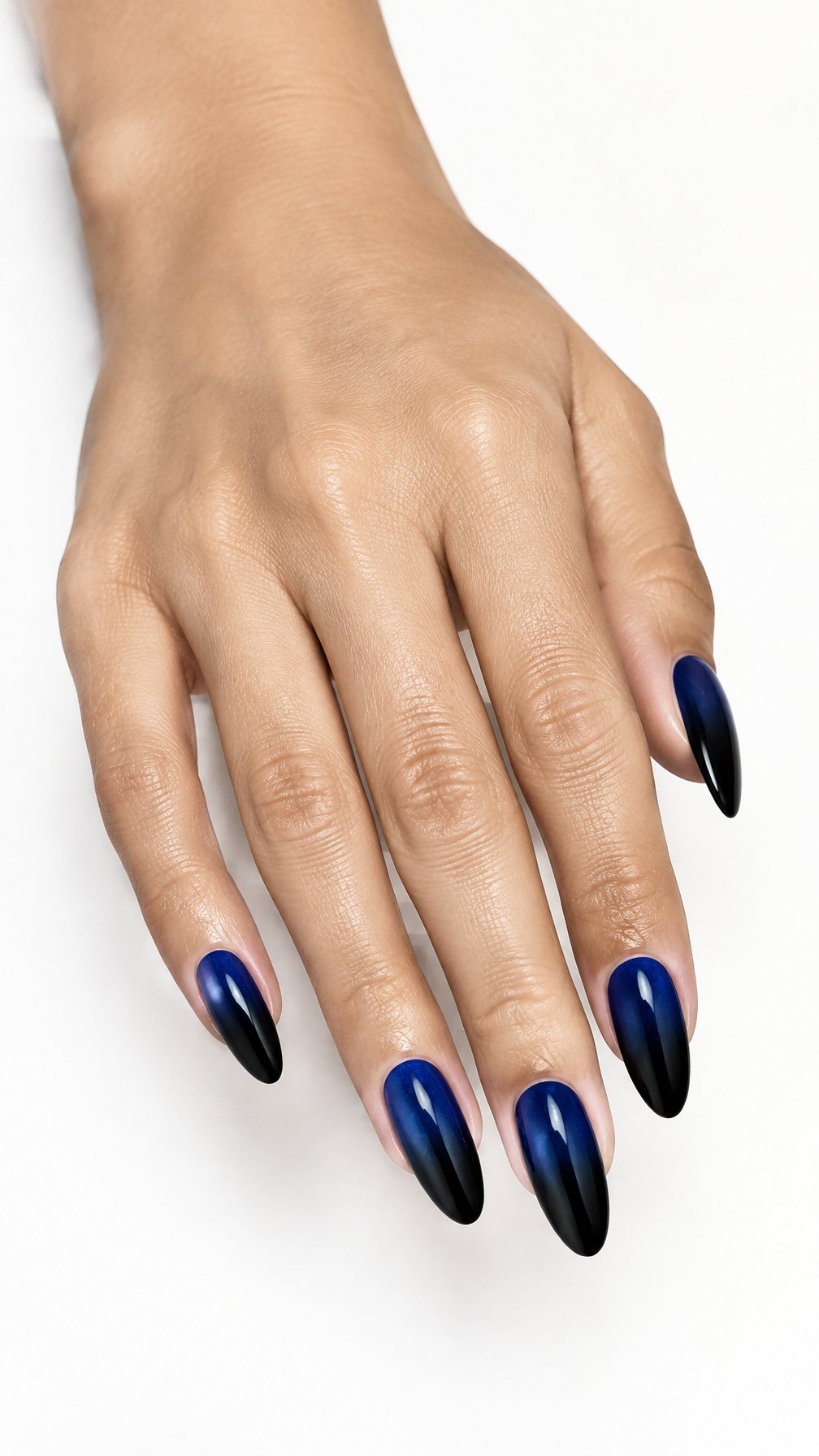 A single hand with glossy almond-shaped nails featuring a midnight blue gradient that fades to black.
