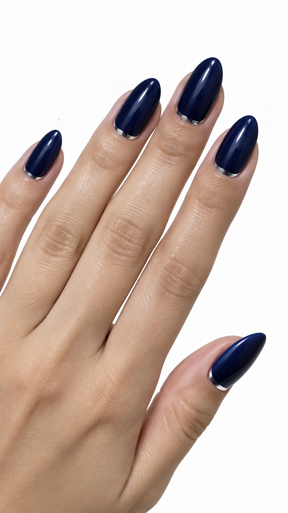 A single hand with glossy midnight blue almond-shaped nails and silver accents along the cuticles on a white background.