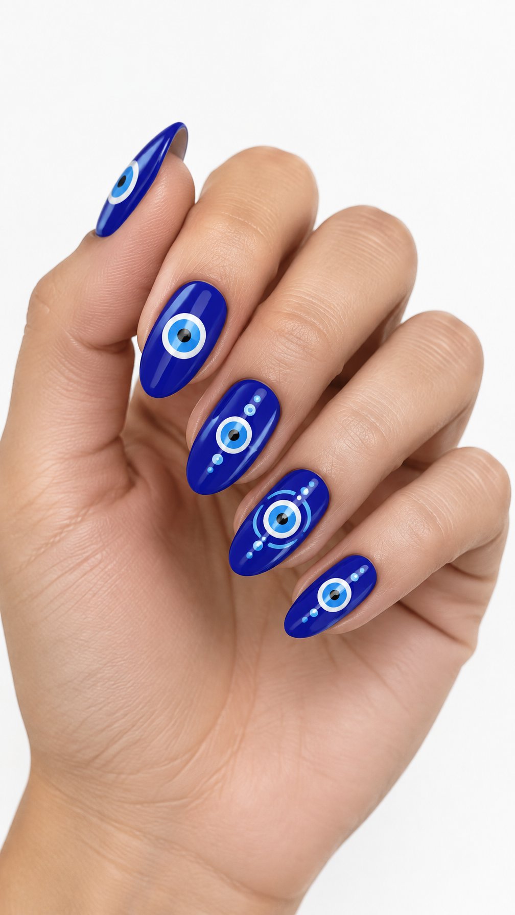 A single hand with glossy electric blue nails decorated with concentric evil eye designs rests against a white background.