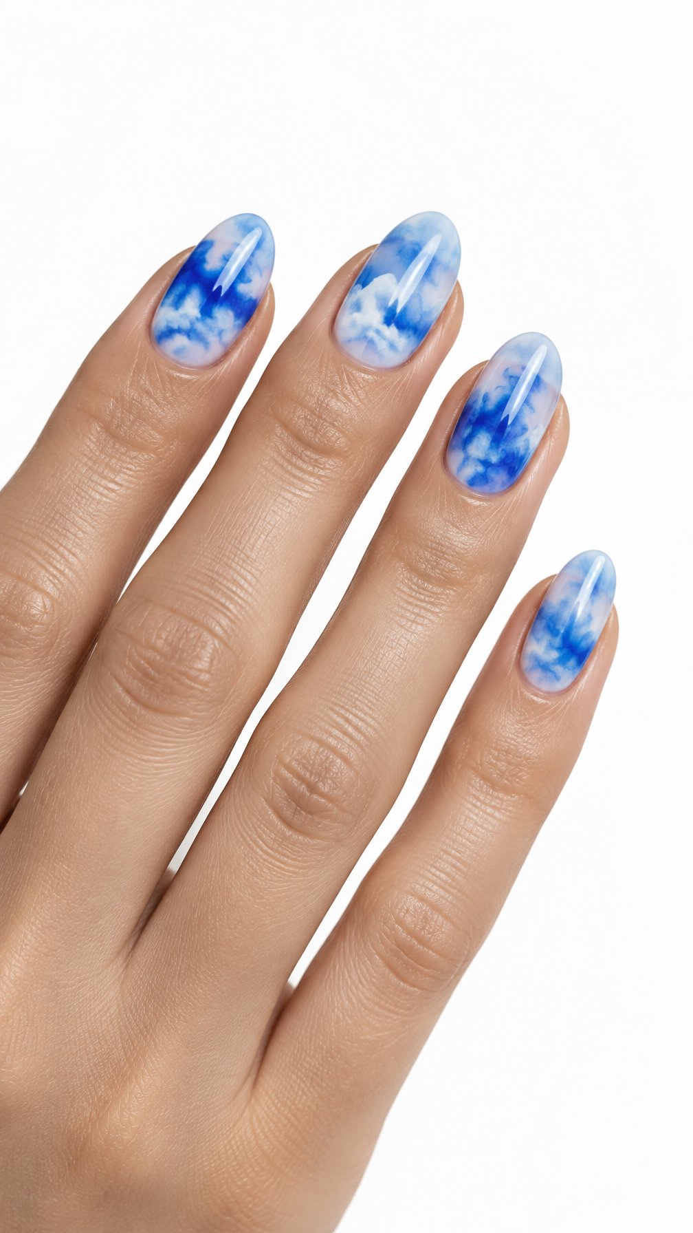 A single hand with glossy almond-shaped nails featuring electric blue watercolor cloud designs on a white background.